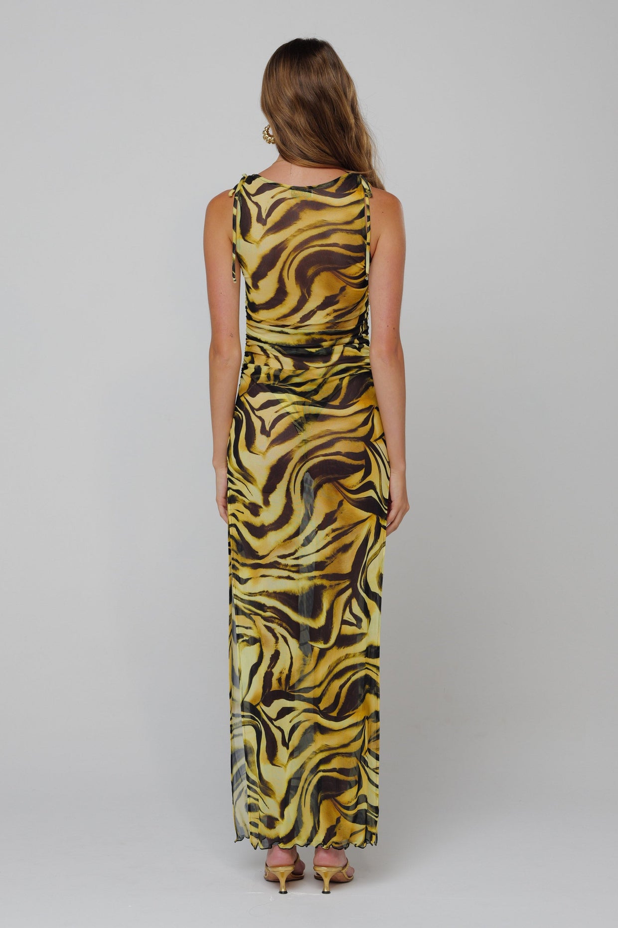 This is an image of Paige Dress in Lioness - RESA featuring a model wearing the dress