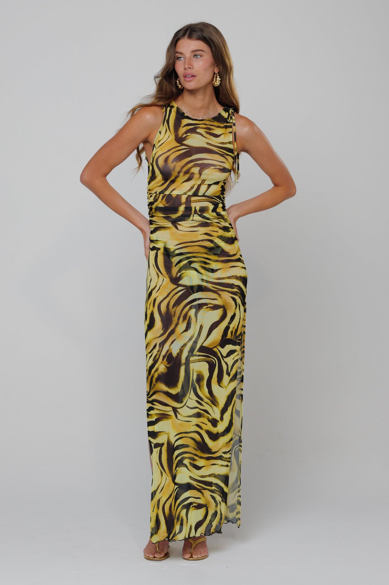 This is an image of Paige Dress in Lioness - RESA featuring a model wearing the dress