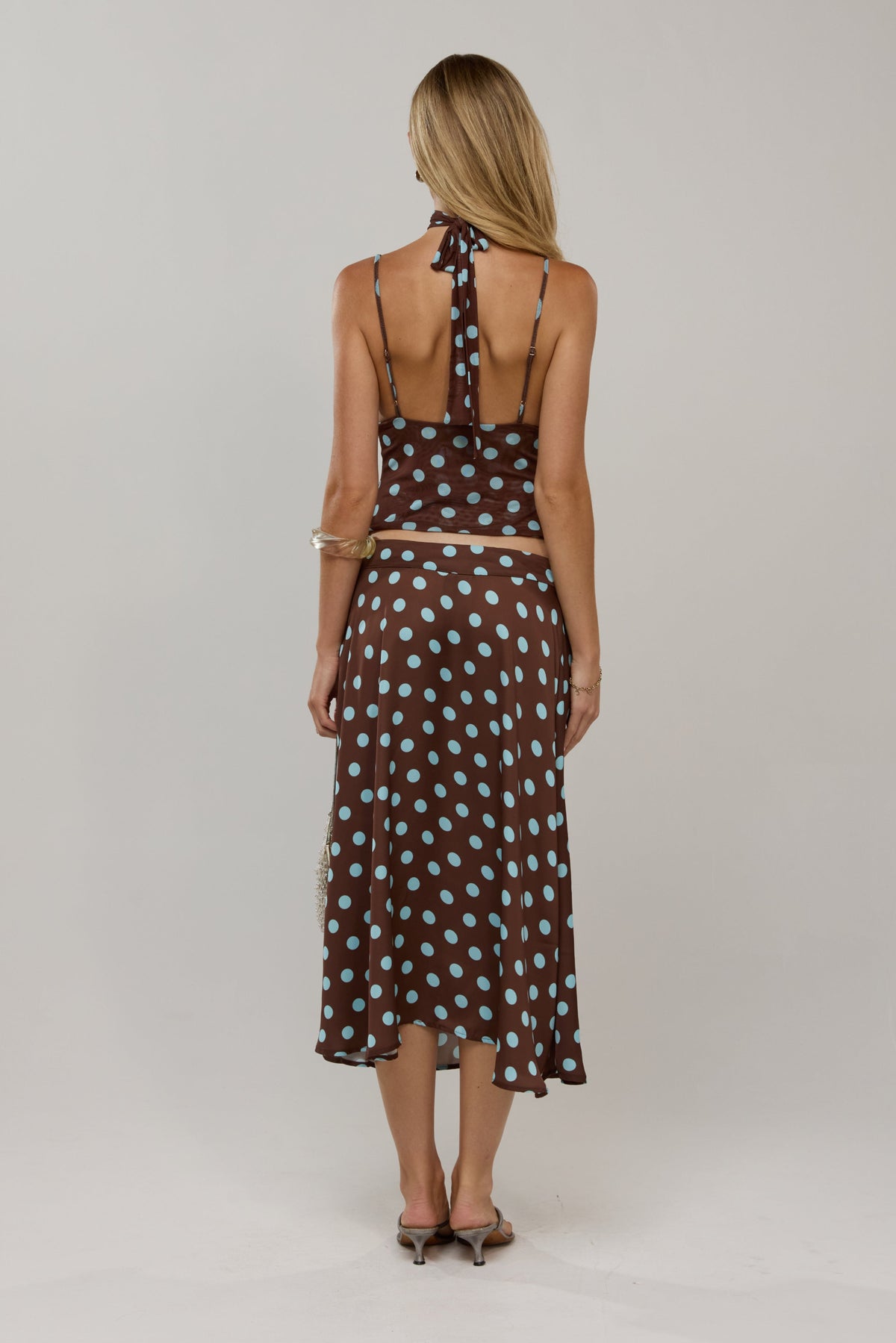 This is an image of Raven in Costa - RESA featuring a model wearing the dress