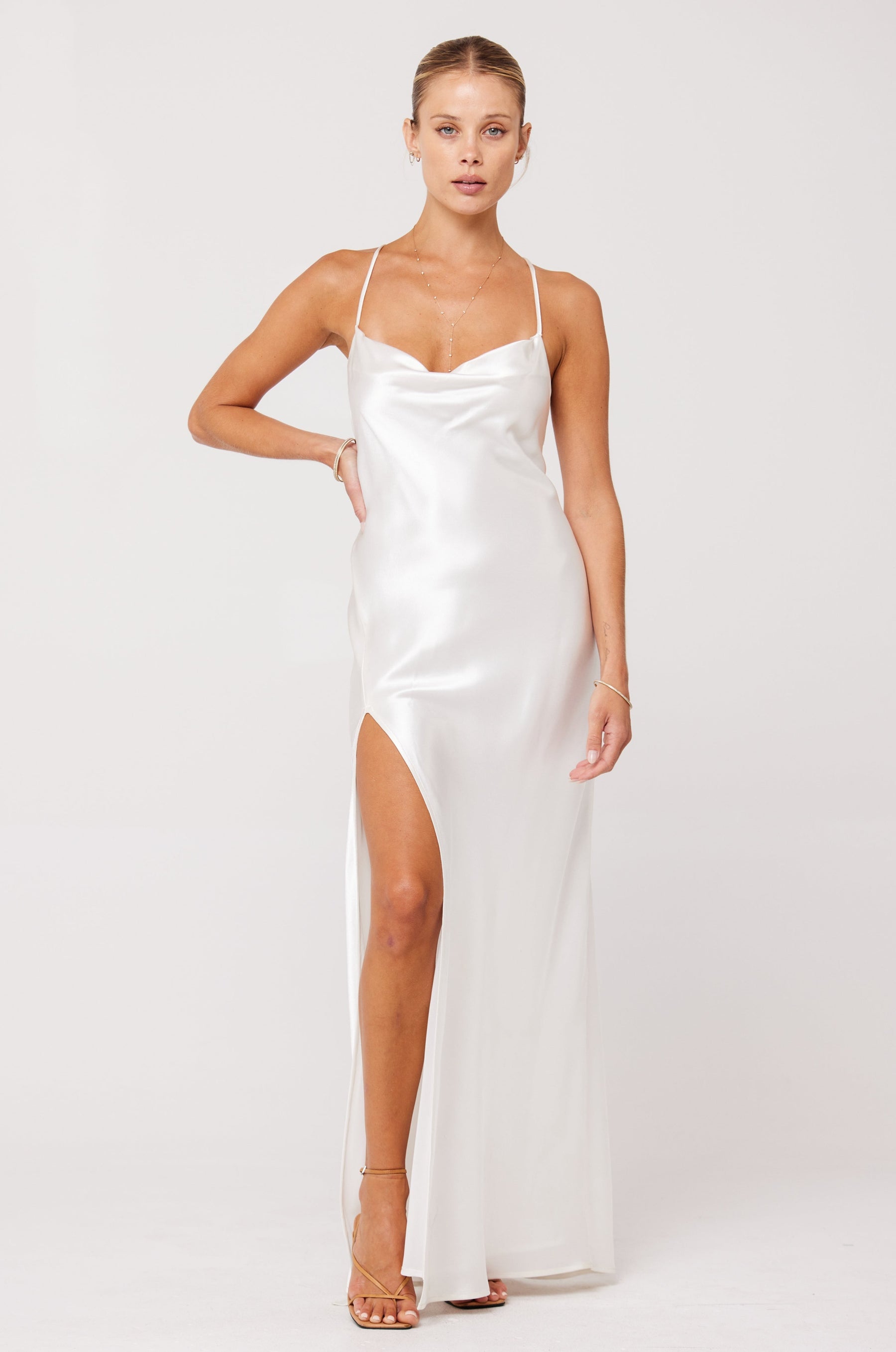 This is an image of RIVER SLIP IN PEARL - SAMPLE SALE - RESA featuring a model wearing the dress