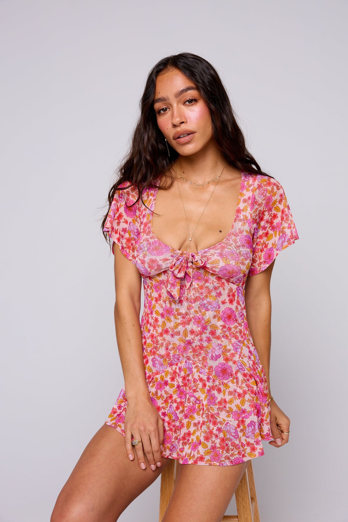 This is an image of ROMY ROMPER IN AUGUSTA - SAMPLE SALE - RESA featuring a model wearing the dress