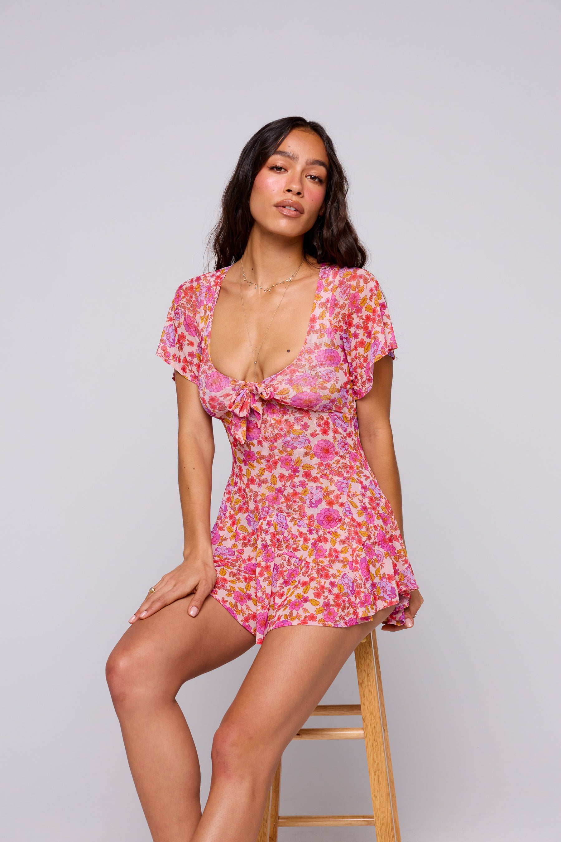 This is an image of ROMY ROMPER IN AUGUSTA - SAMPLE SALE - RESA featuring a model wearing the dress