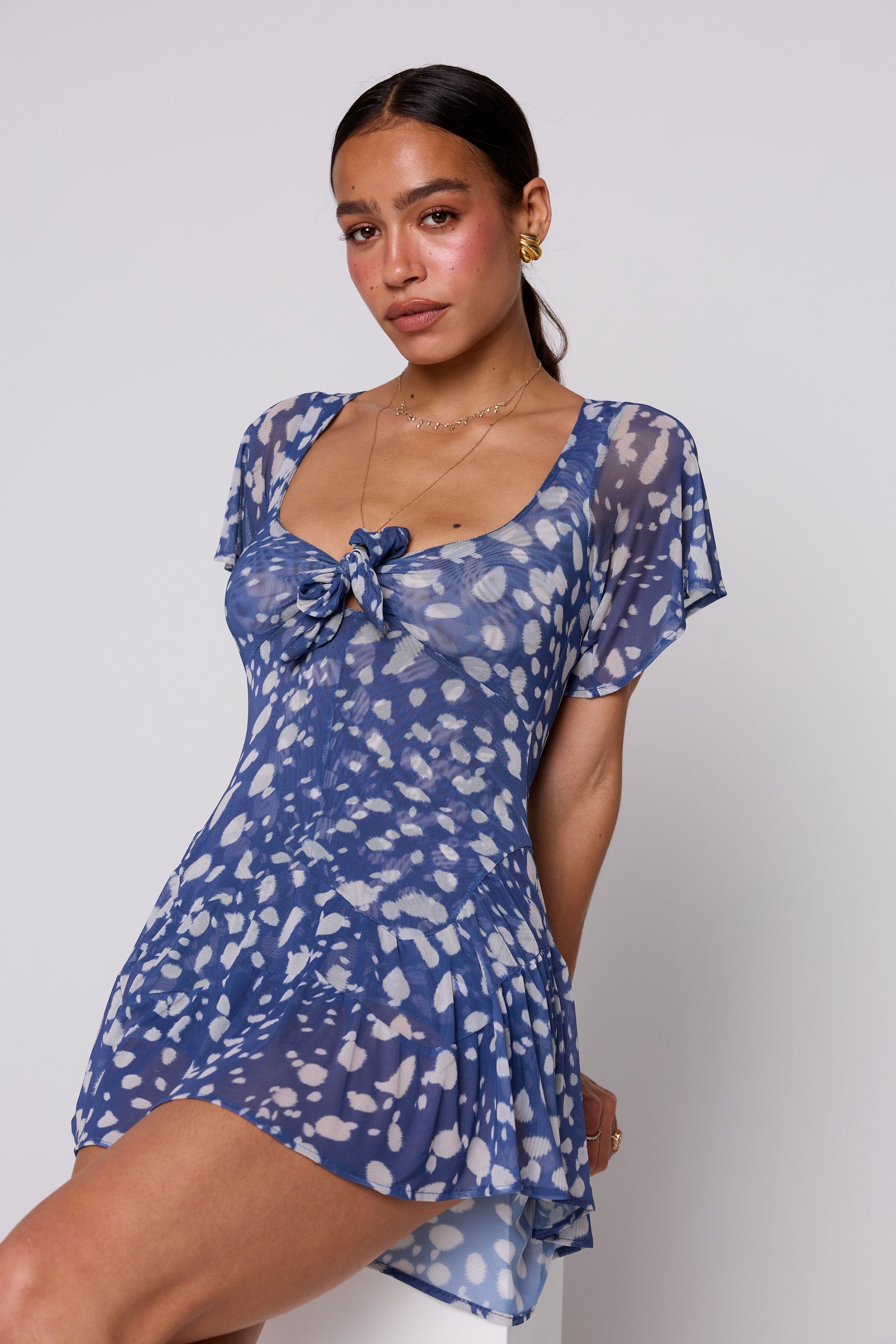 This is an image of Romy Romper in Cove - RESA featuring a model wearing the dress