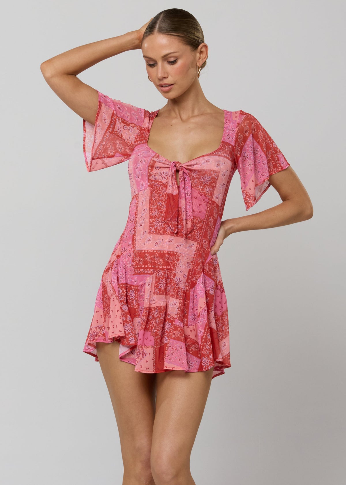 This is an image of Romy Romper in Patsy - RESA featuring a model wearing the dress