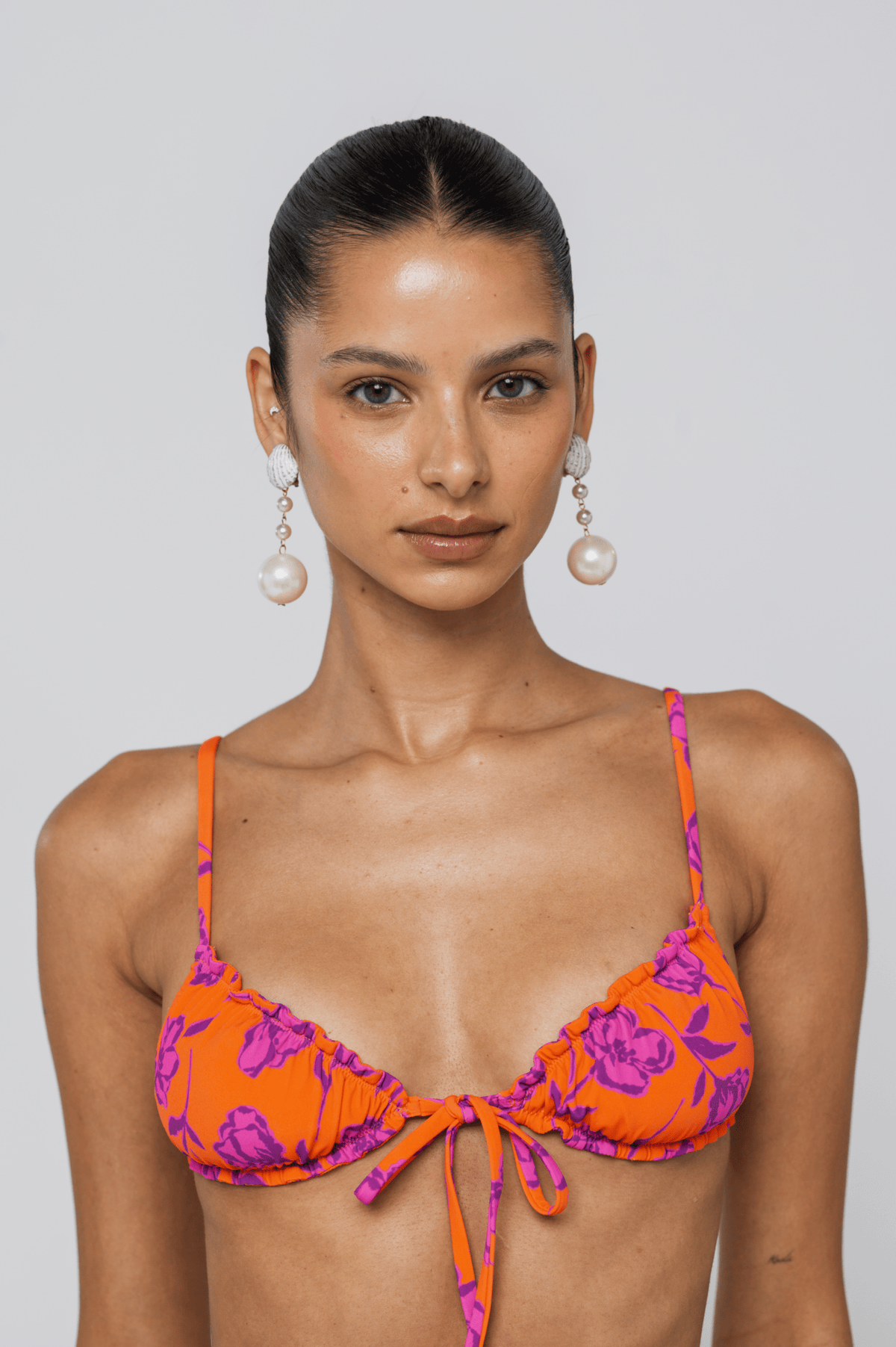 This is an image of Ryan Top in Mandarin - RESA featuring a model wearing the dress