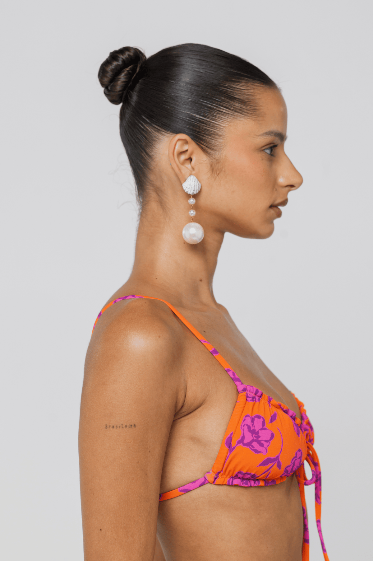This is an image of Ryan Top in Mandarin - RESA featuring a model wearing the dress