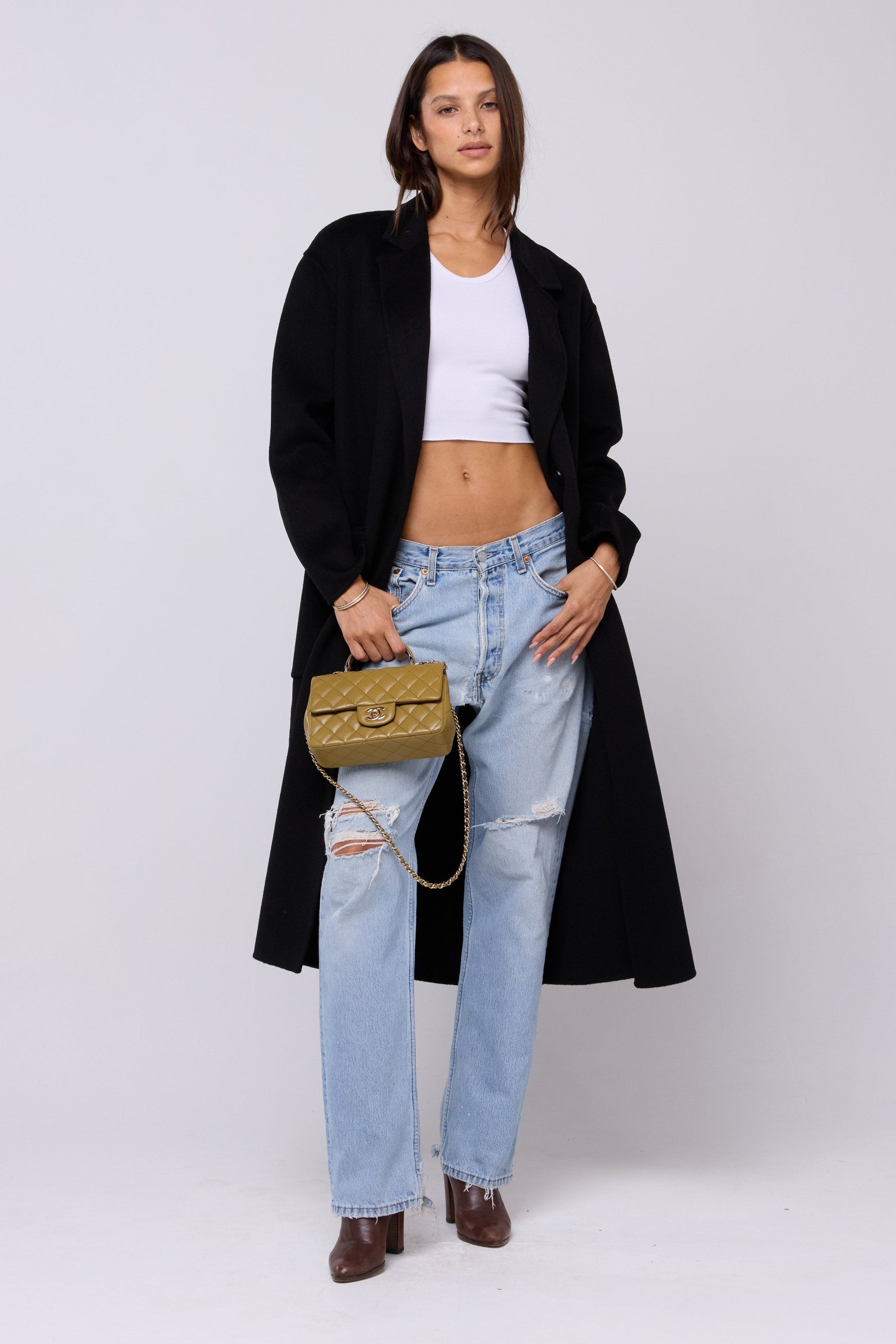 This is an image of Ryder Coat in Black - RESA featuring a model wearing the dress