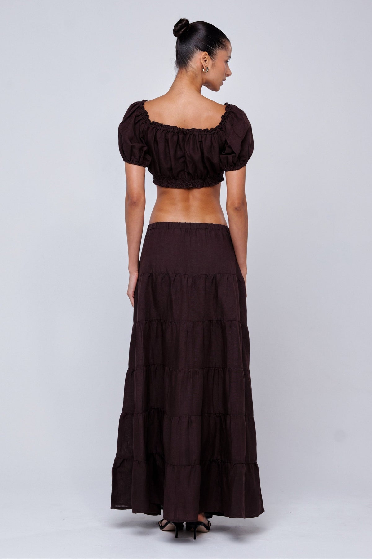 This is an image of Saige Top in Brown Linen - RESA featuring a model wearing the dress