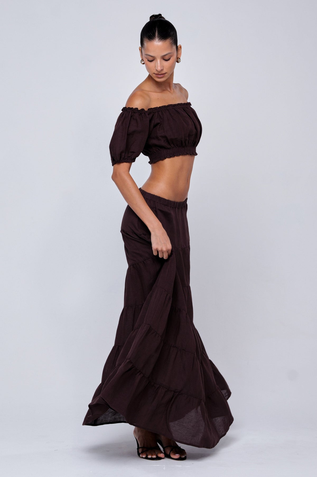 This is an image of Saige Top in Brown Linen - RESA featuring a model wearing the dress