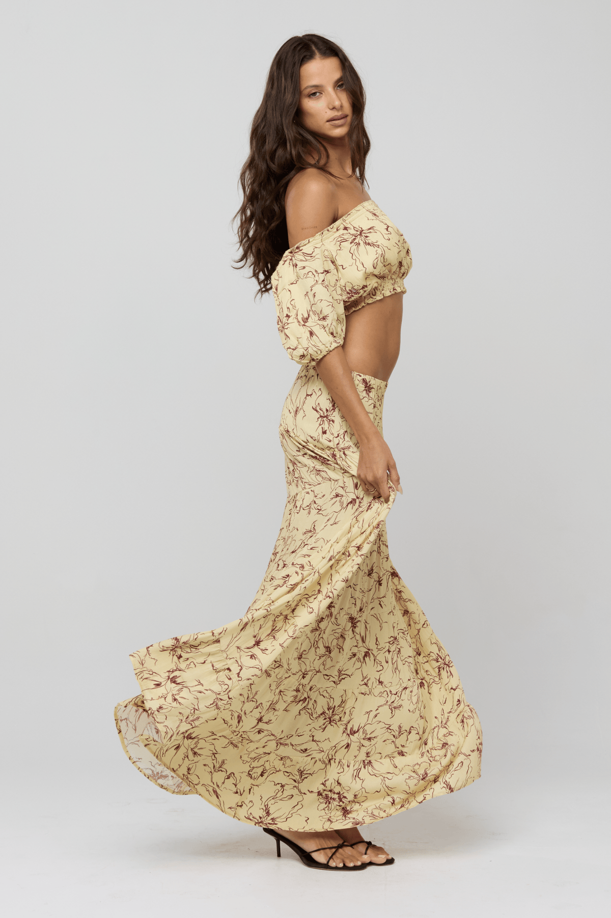 This is an image of Saige Top in Butterscotch - RESA featuring a model wearing the dress