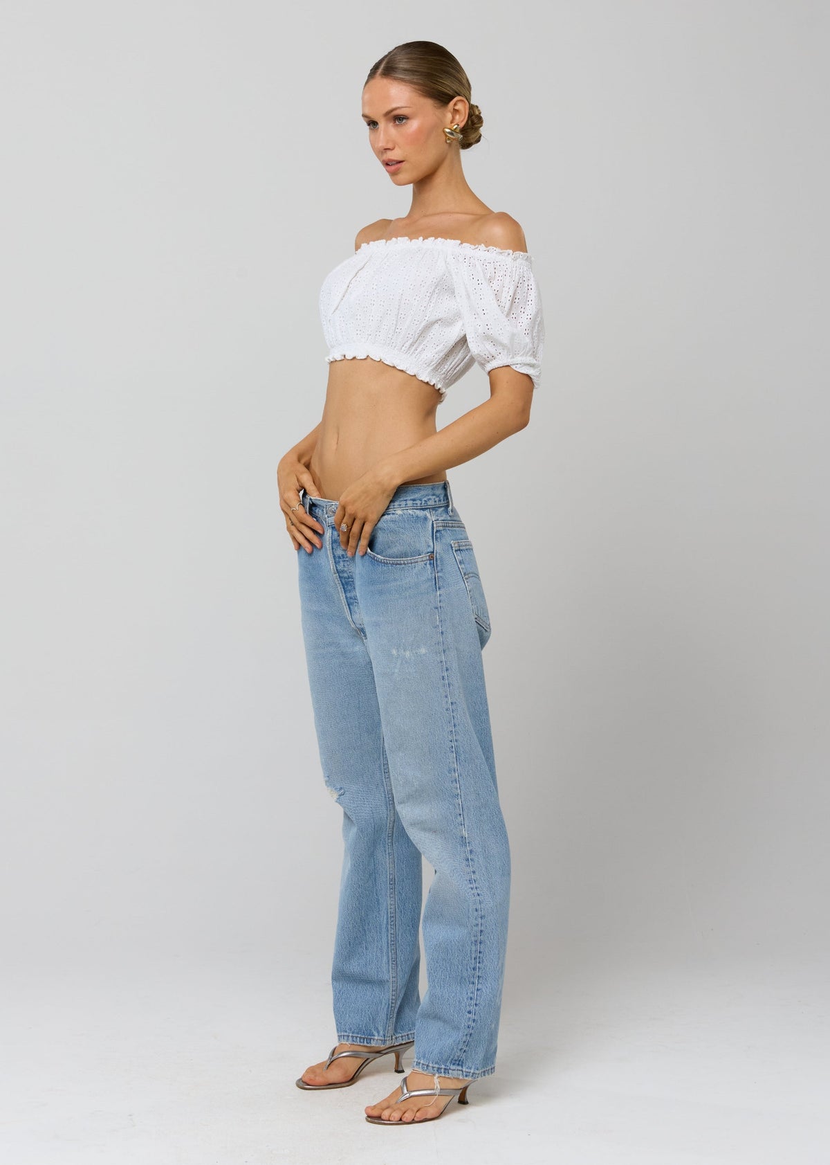 This is an image of Saige Top in White Eyelet - RESA featuring a model wearing the dress