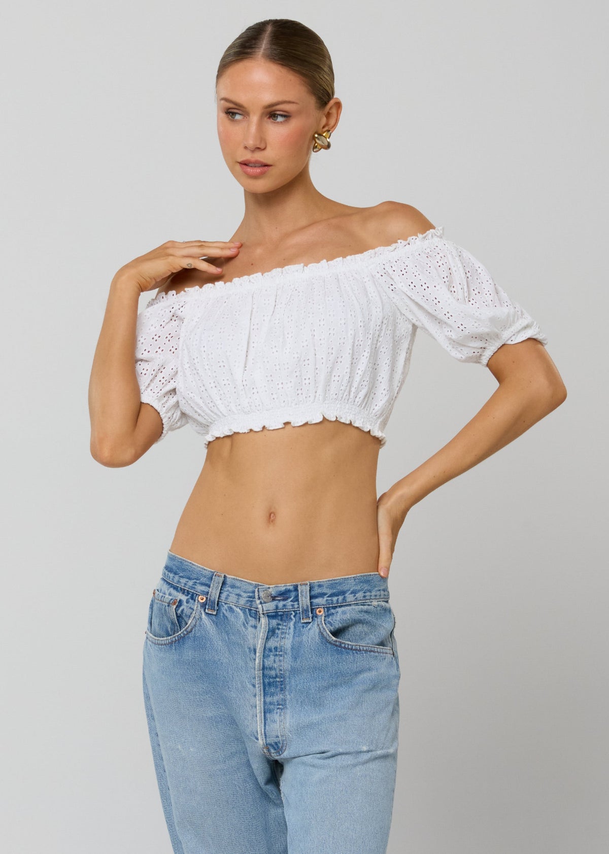 This is an image of Saige Top in White Eyelet - RESA featuring a model wearing the dress