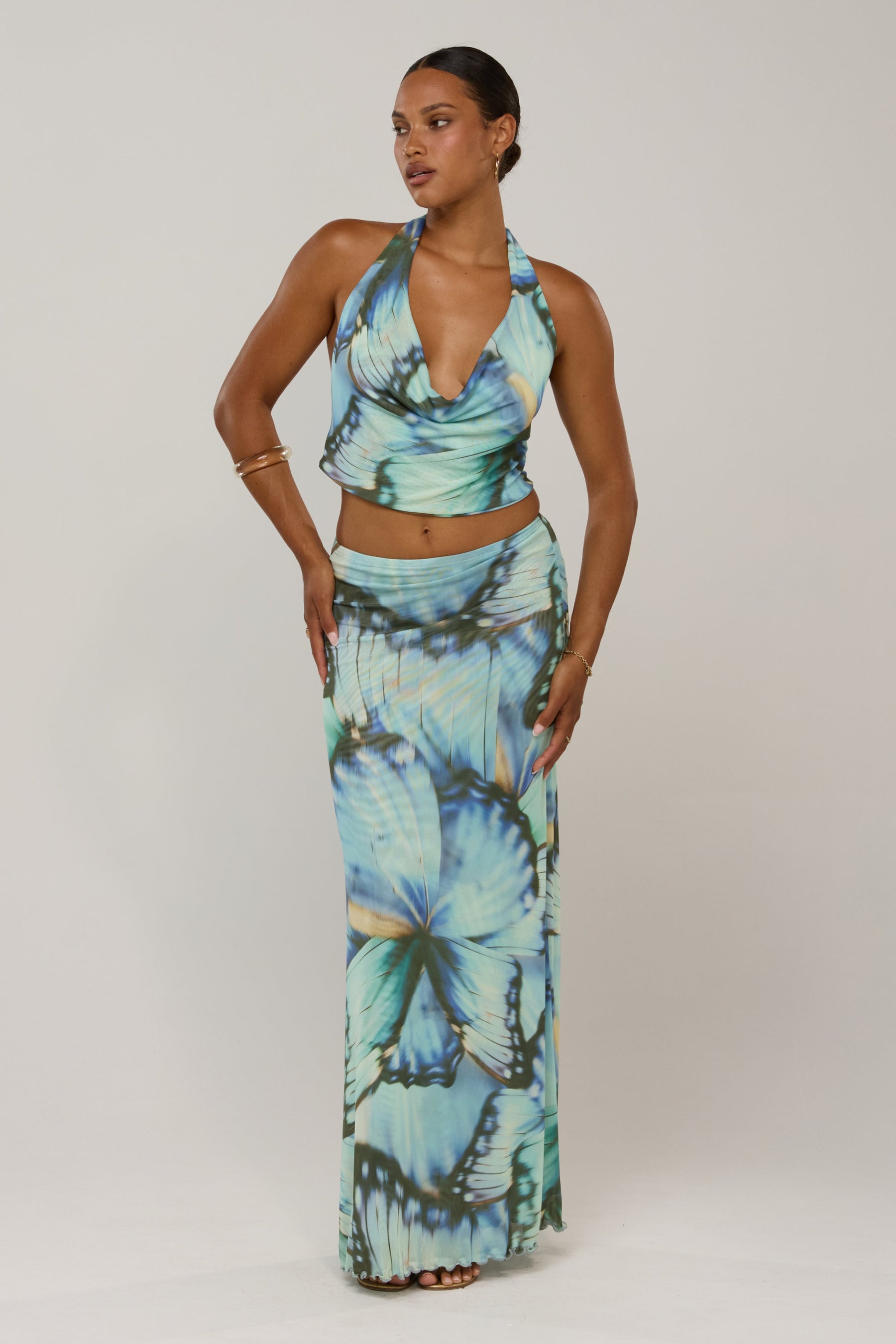 This is an image of Sarah in Mariposa - RESA featuring a model wearing the dress