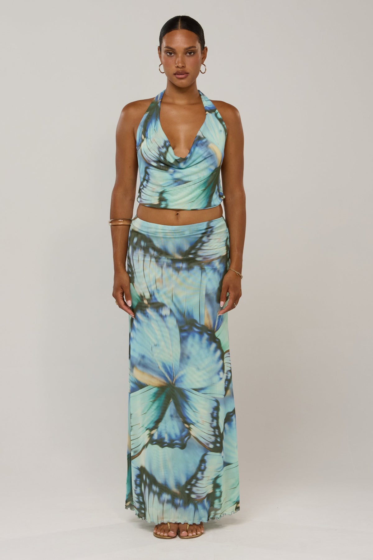 This is an image of Sarah in Mariposa - RESA featuring a model wearing the dress