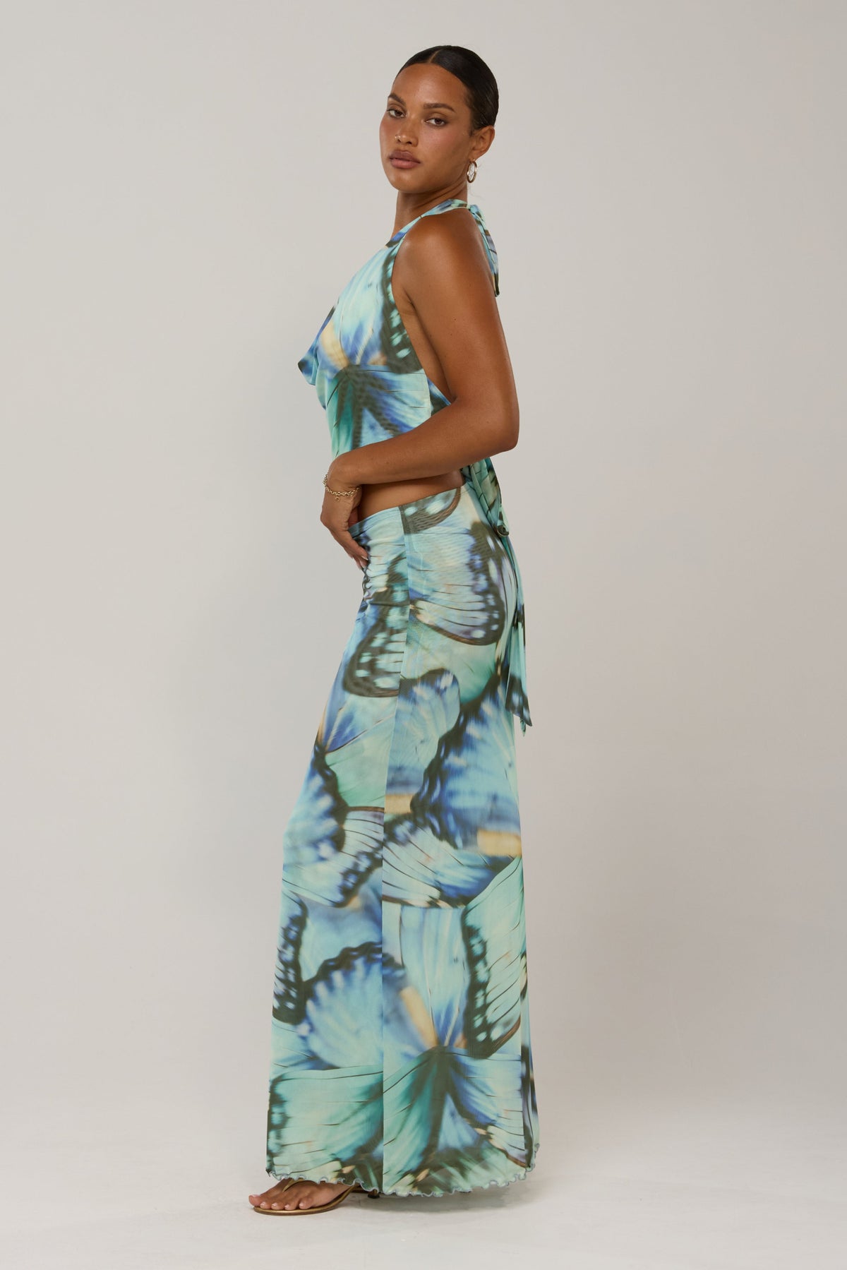 This is an image of Sarah in Mariposa - RESA featuring a model wearing the dress
