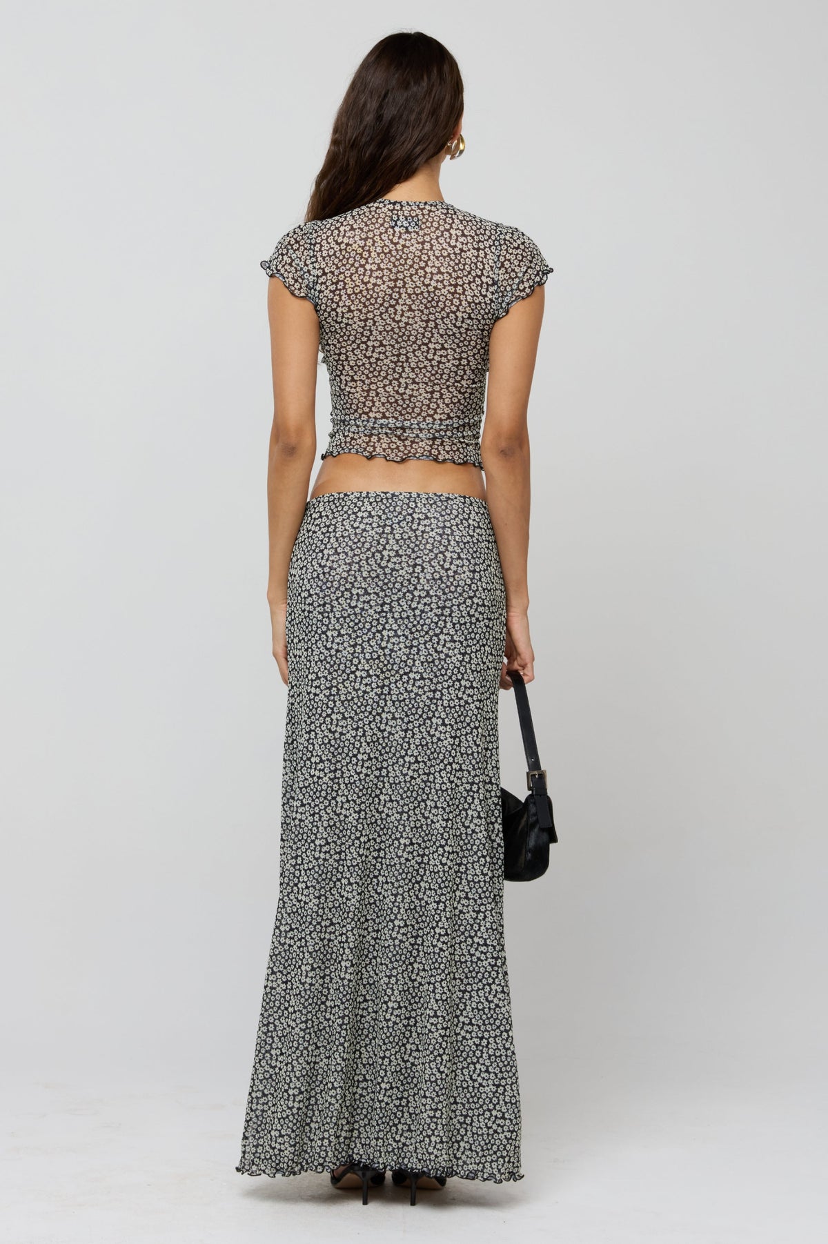 This is an image of Sarah Skirt in Flores - RESA featuring a model wearing the dress