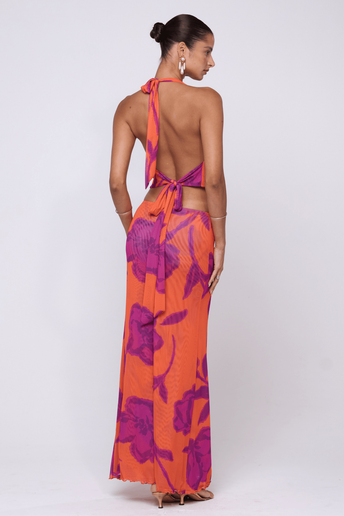 This is an image of Sarah Skirt in Mandarin - RESA featuring a model wearing the dress