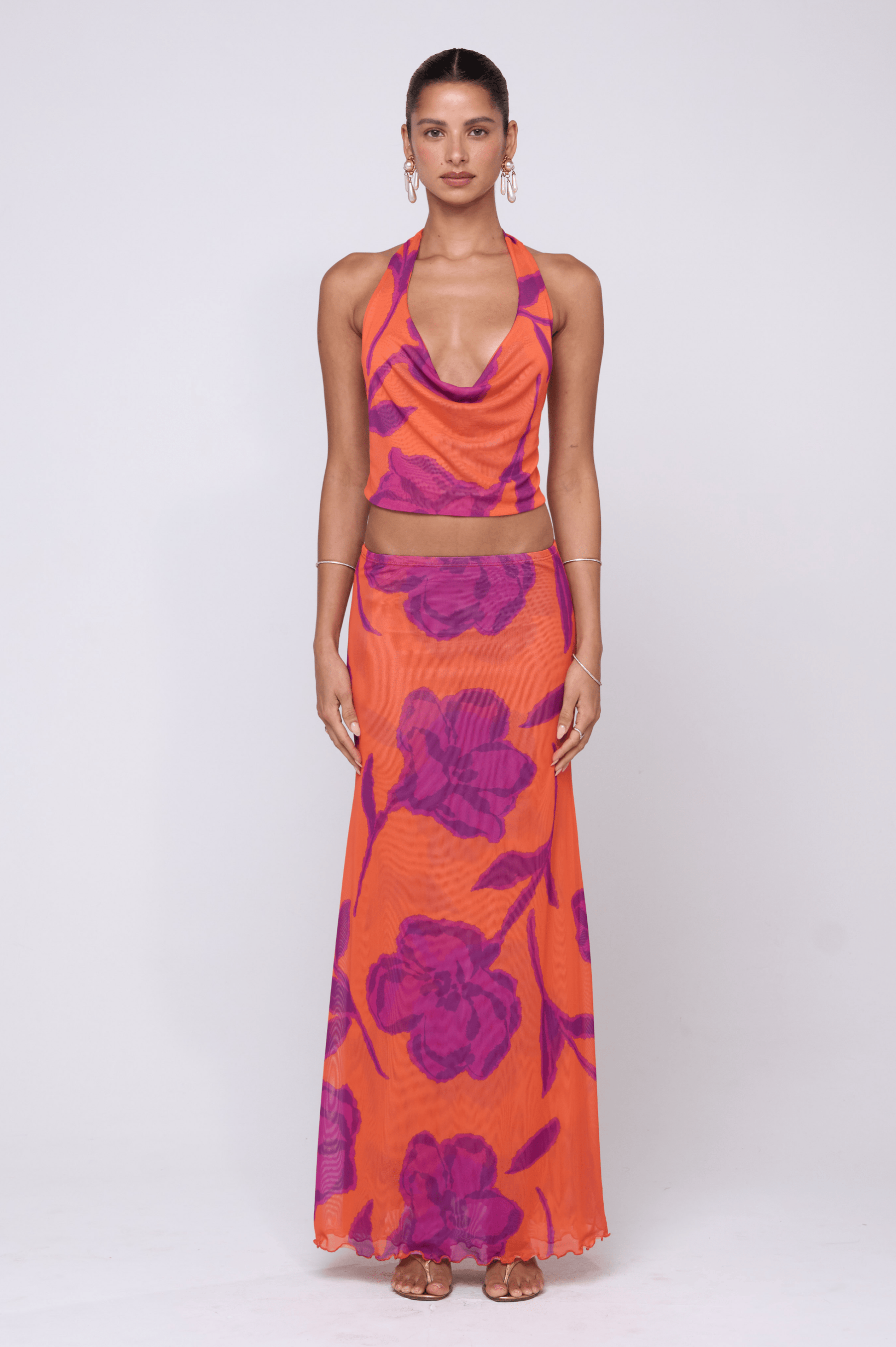 This is an image of Sarah Skirt in Mandarin - RESA featuring a model wearing the dress
