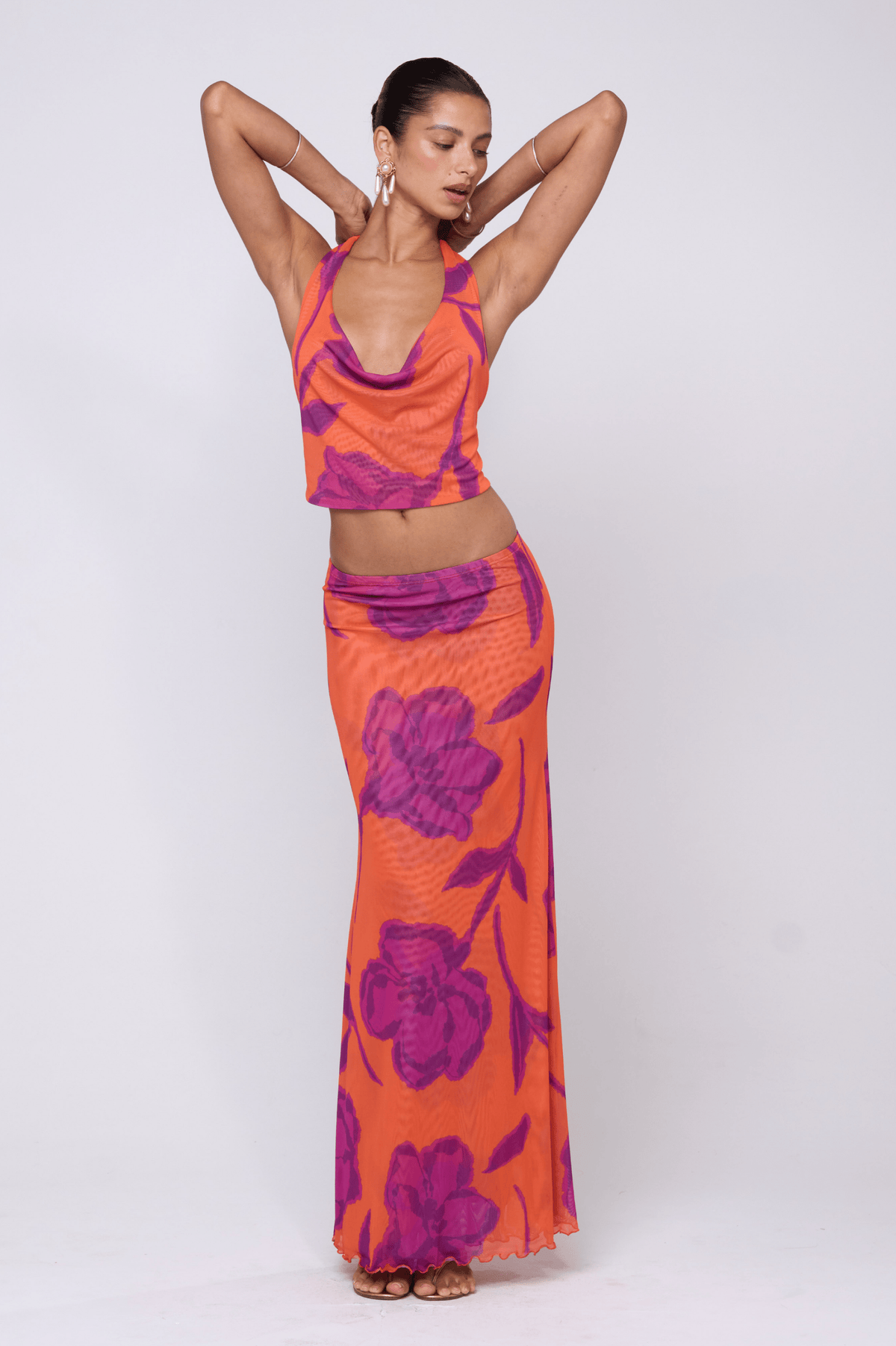 This is an image of Sarah Skirt in Mandarin - RESA featuring a model wearing the dress