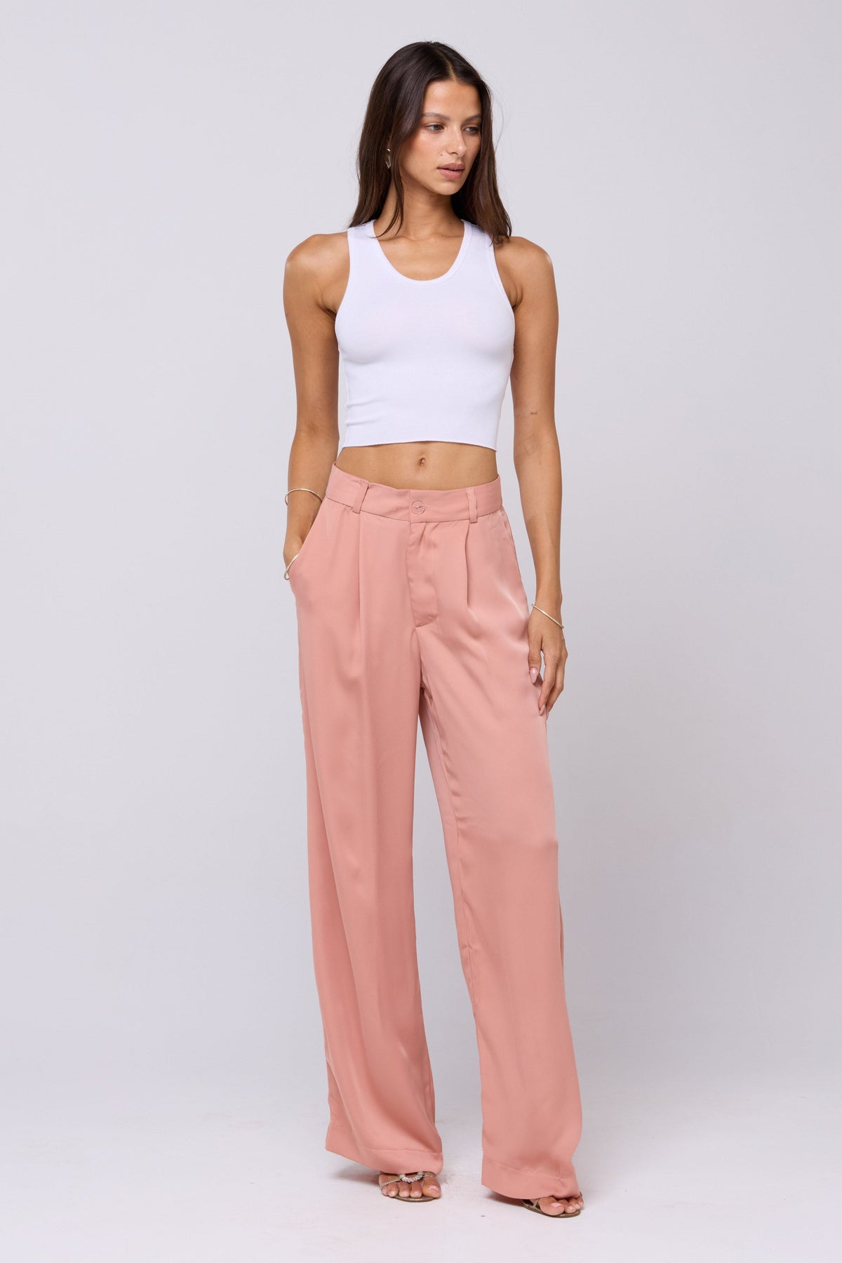 This is an image of Sasha Trouser in Blush - RESA featuring a model wearing the dress