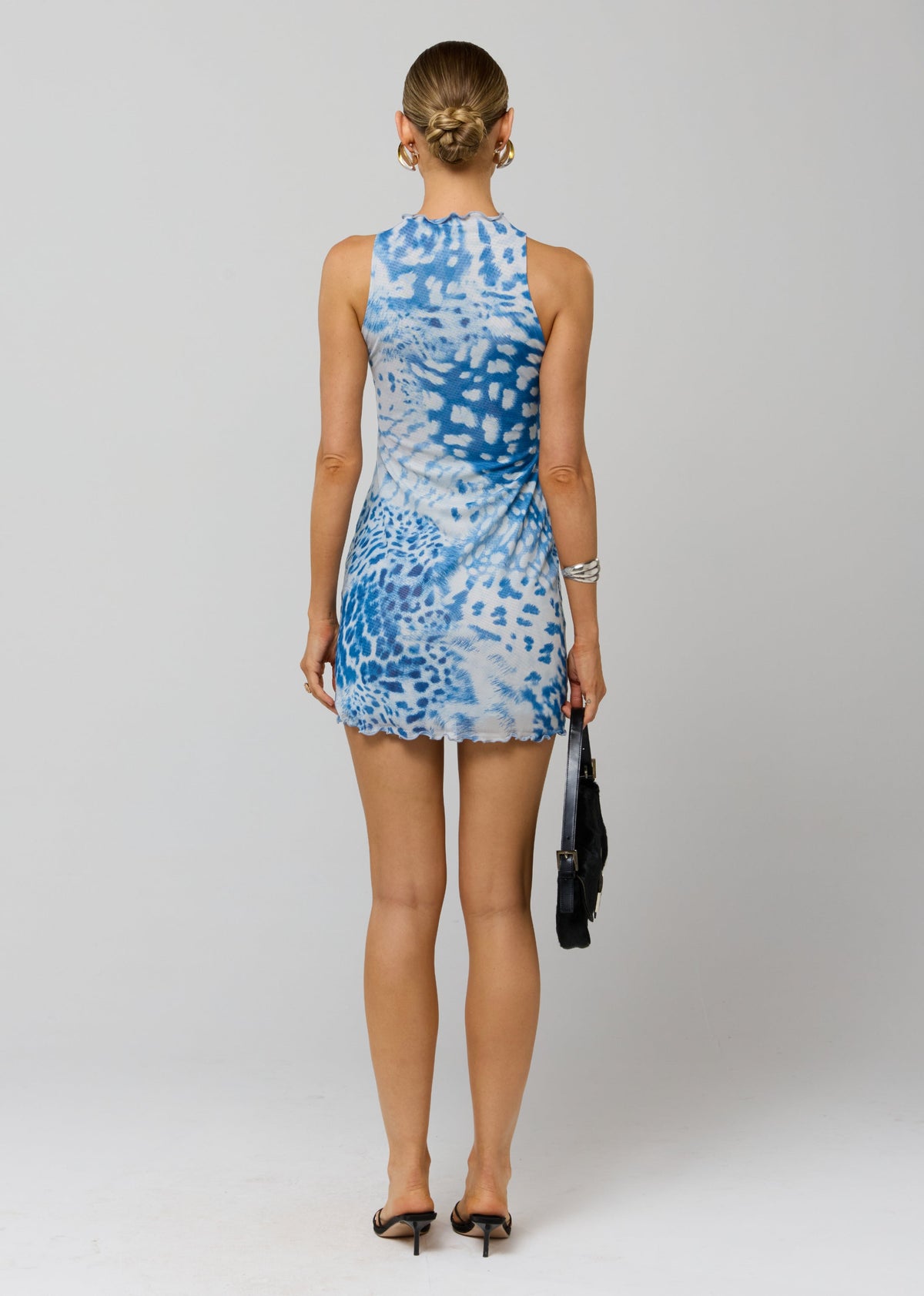 This is an image of Savannah Mini in Neve - RESA featuring a model wearing the dress