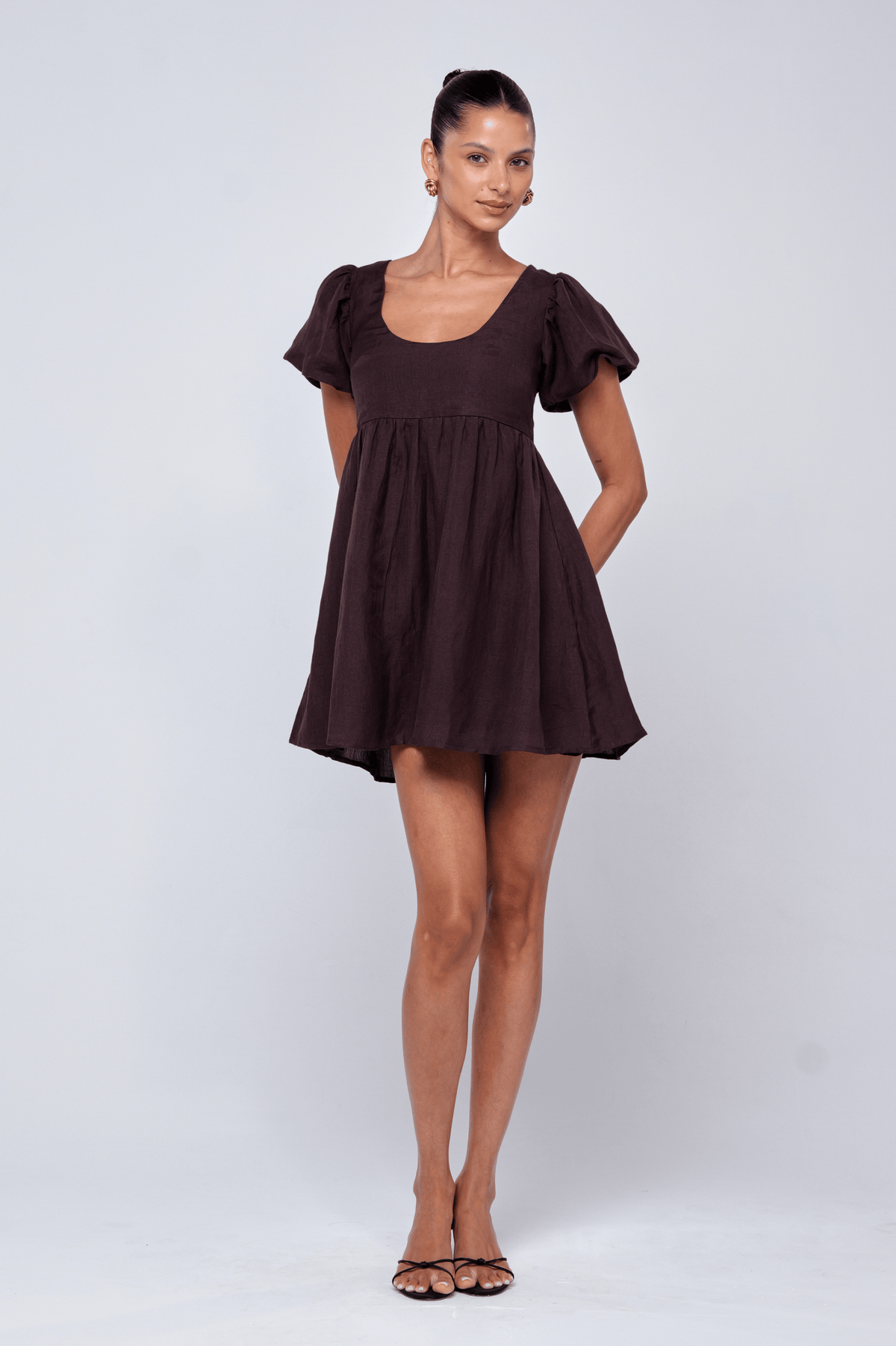This is an image of Shay Mini in Brown Linen - RESA featuring a model wearing the dress