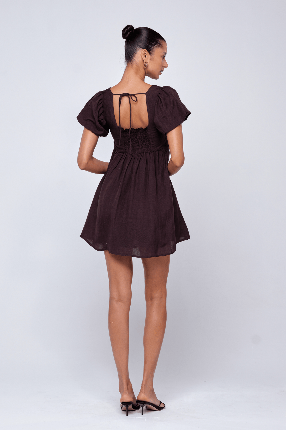 This is an image of Shay Mini in Brown Linen - RESA featuring a model wearing the dress