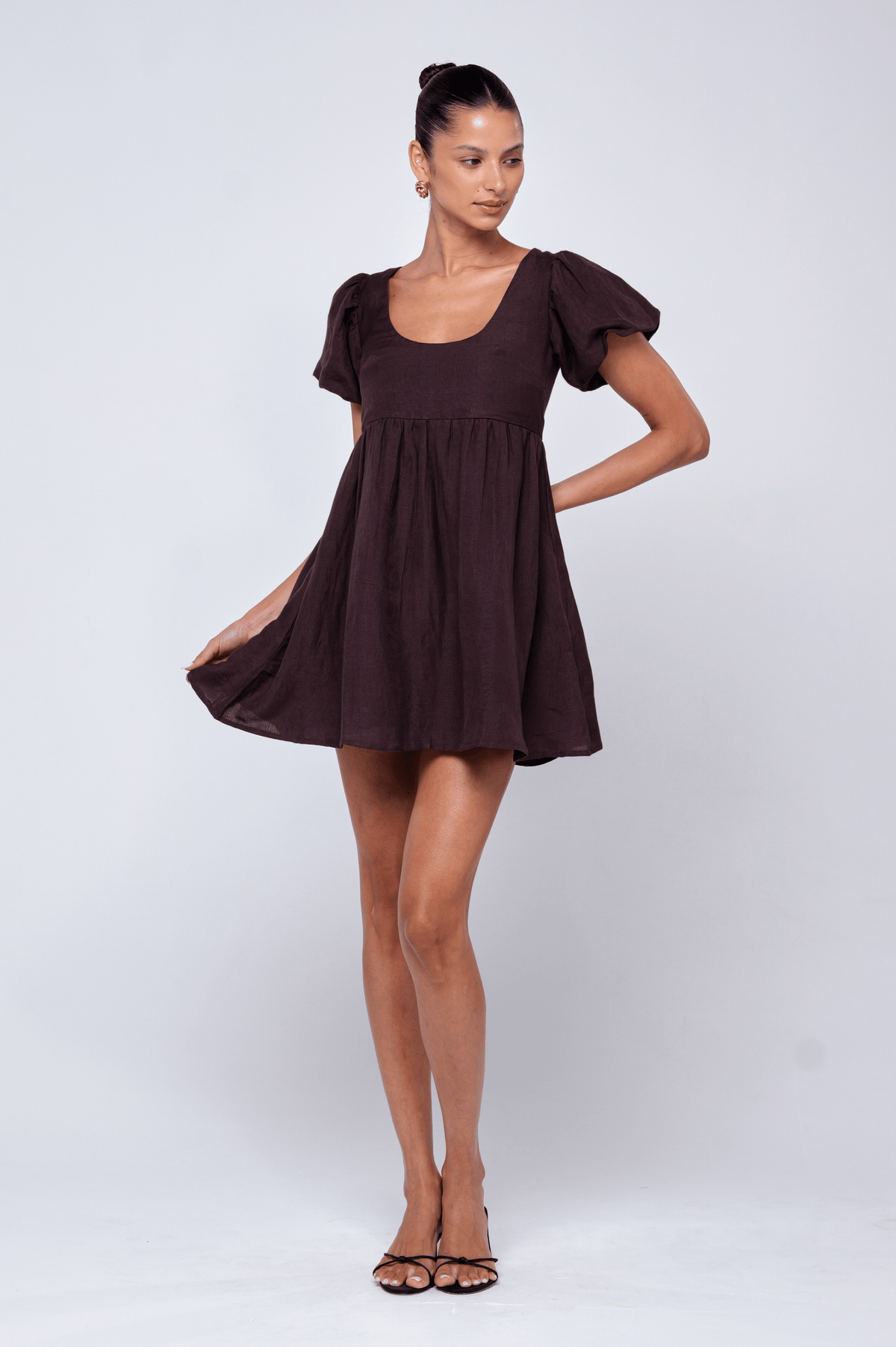 This is an image of Shay Mini in Brown Linen - RESA featuring a model wearing the dress