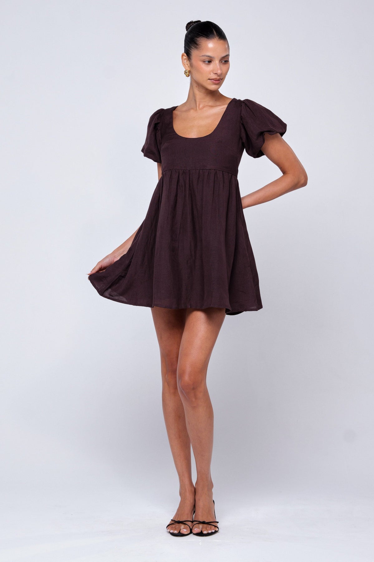 This is an image of Shay Mini in Brown Linen - RESA featuring a model wearing the dress