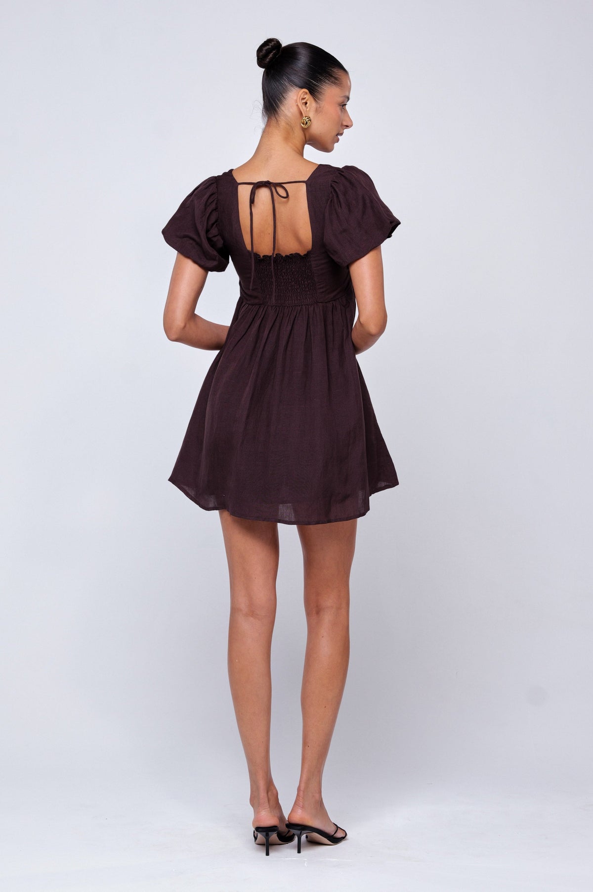 This is an image of Shay Mini in Brown Linen - RESA featuring a model wearing the dress