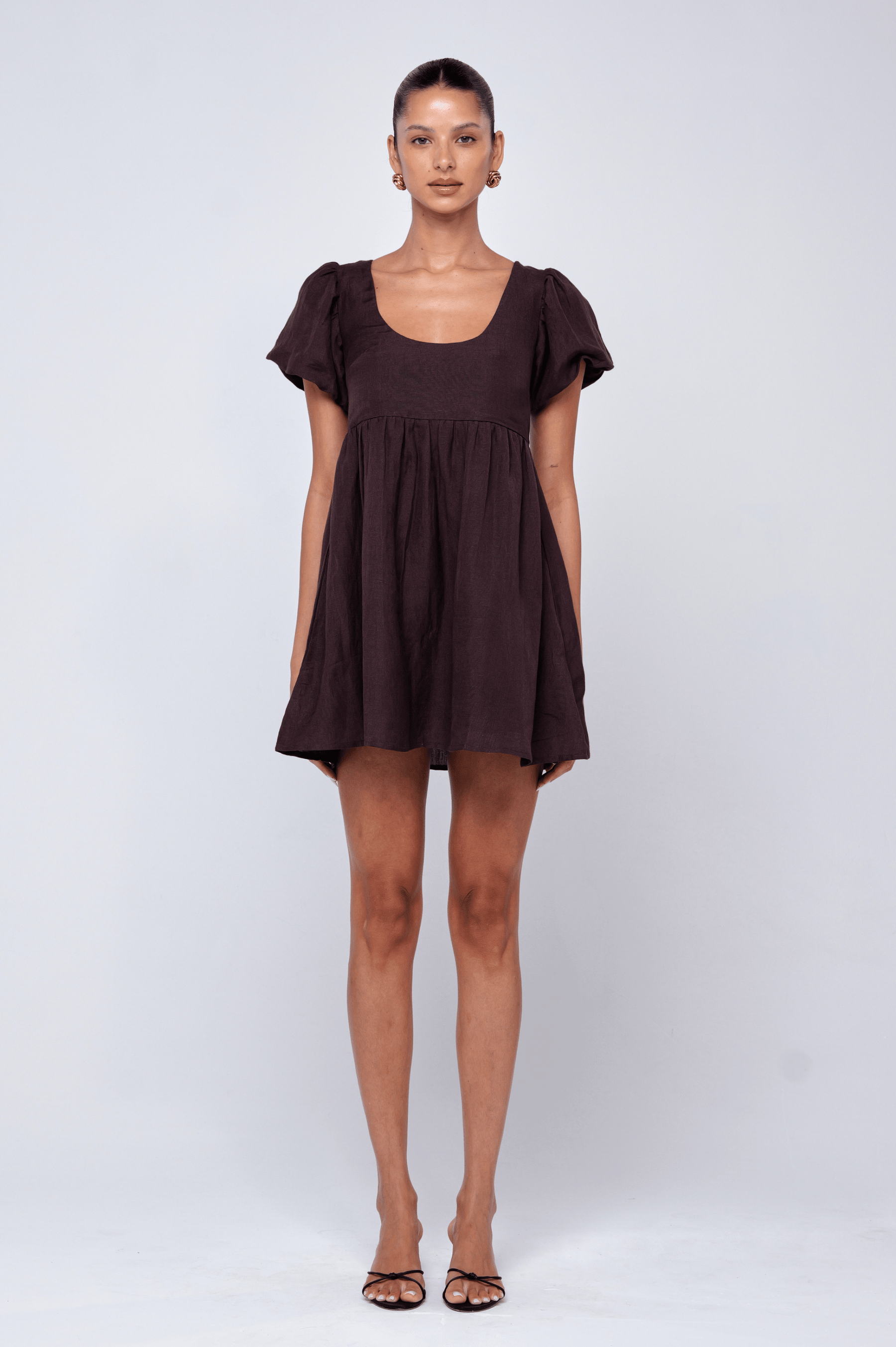 This is an image of Shay Mini in Brown Linen - RESA featuring a model wearing the dress