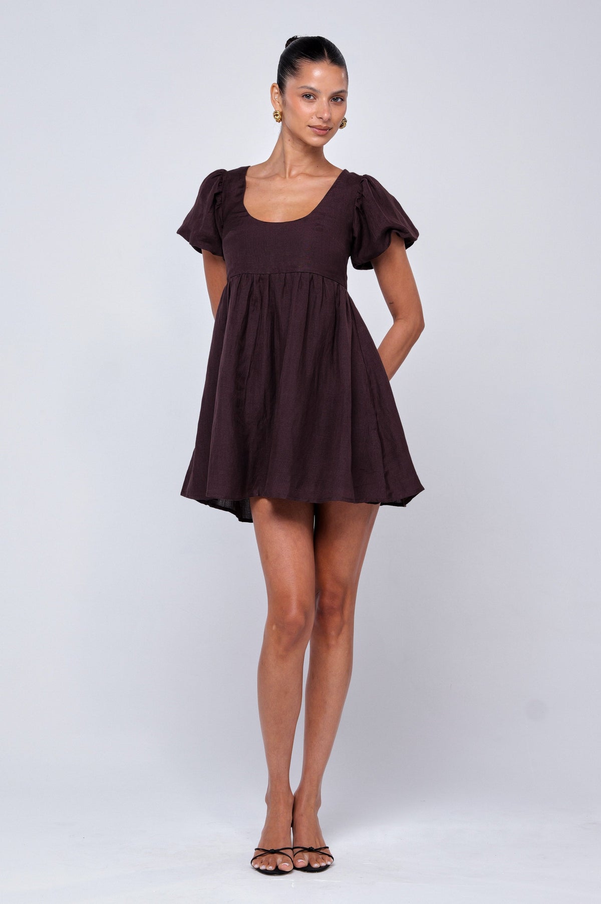 This is an image of Shay Mini in Brown Linen - RESA featuring a model wearing the dress