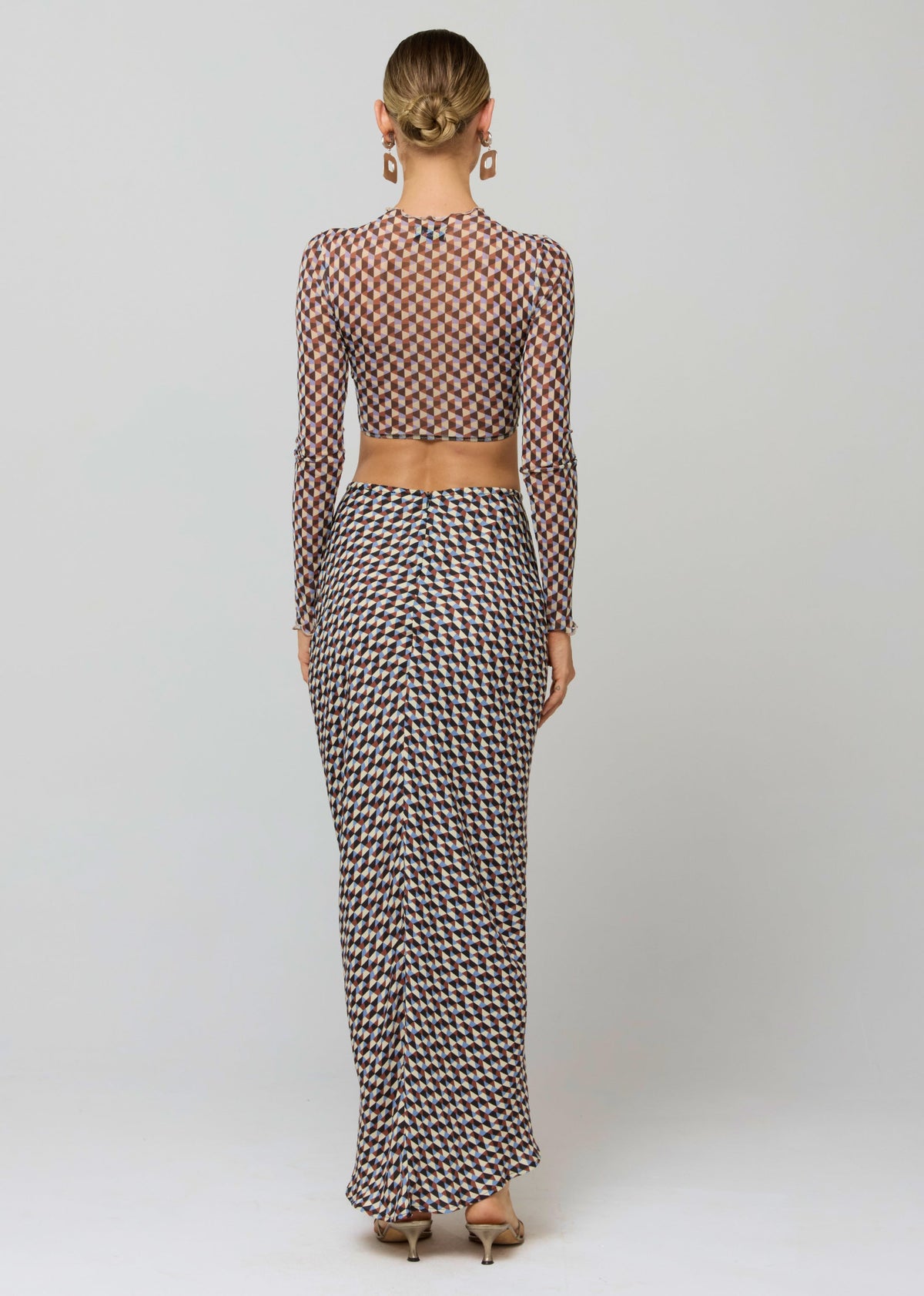 This is an image of Shelby Top in Mosiac - RESA featuring a model wearing the dress