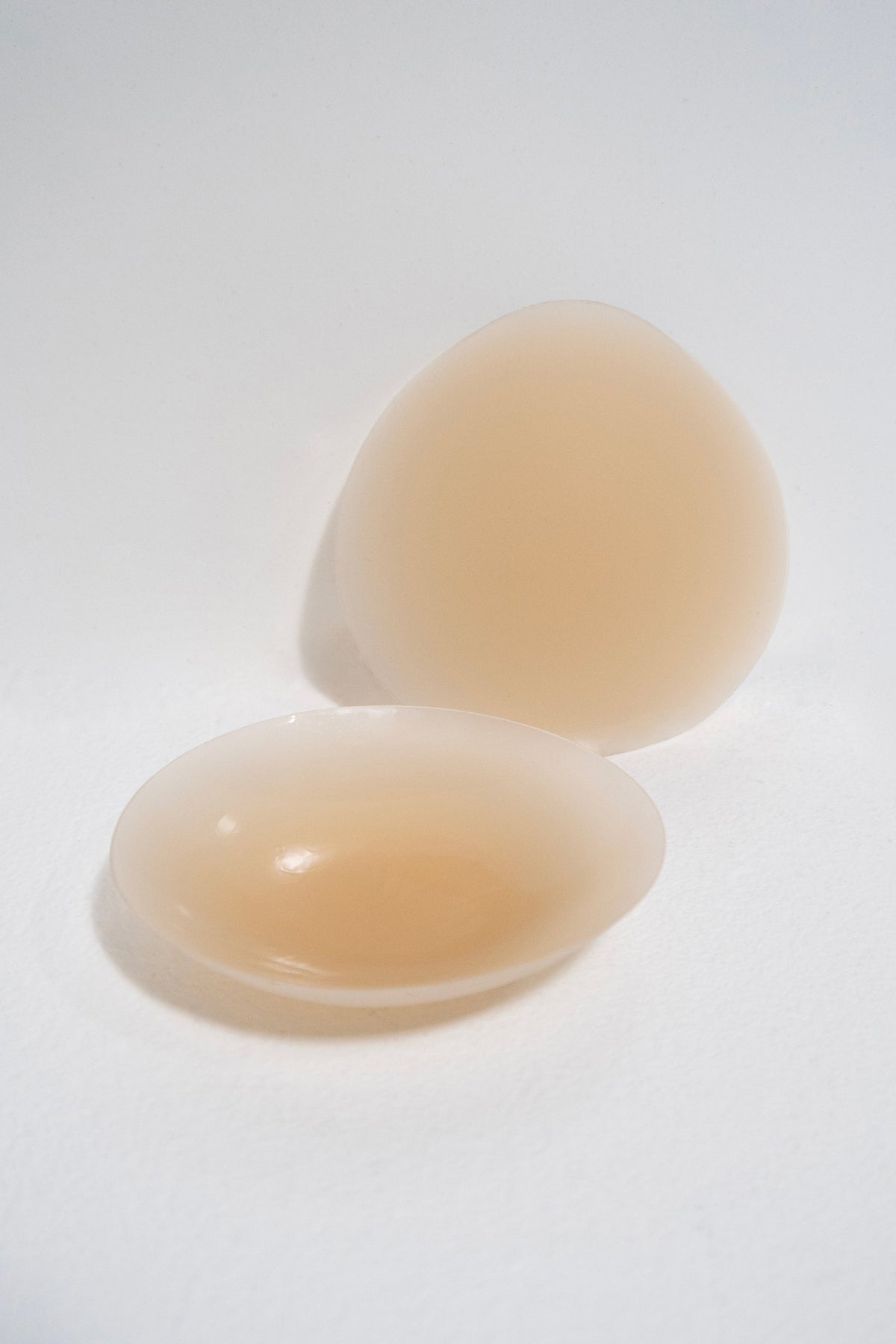 This is an image of Silicone Pasties in Light Nude - RESA featuring a model wearing the dress