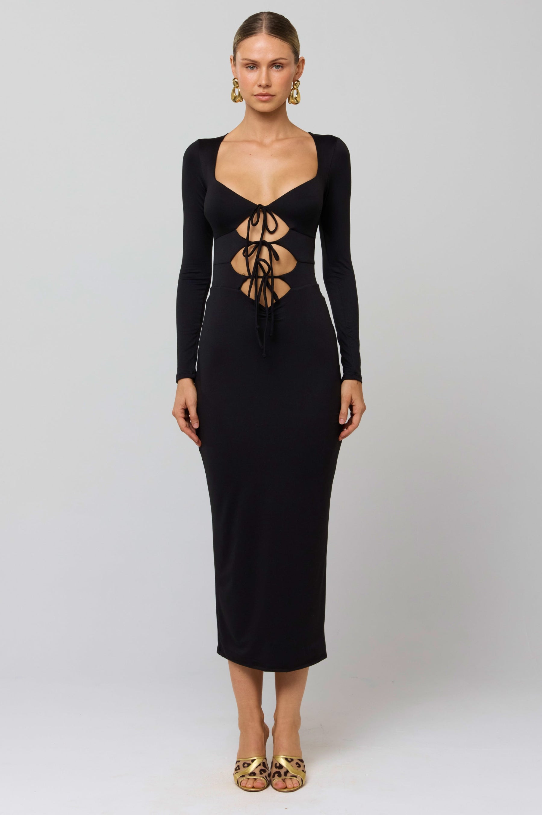 This is an image of Simone Dress in Black - RESA featuring a model wearing the dress