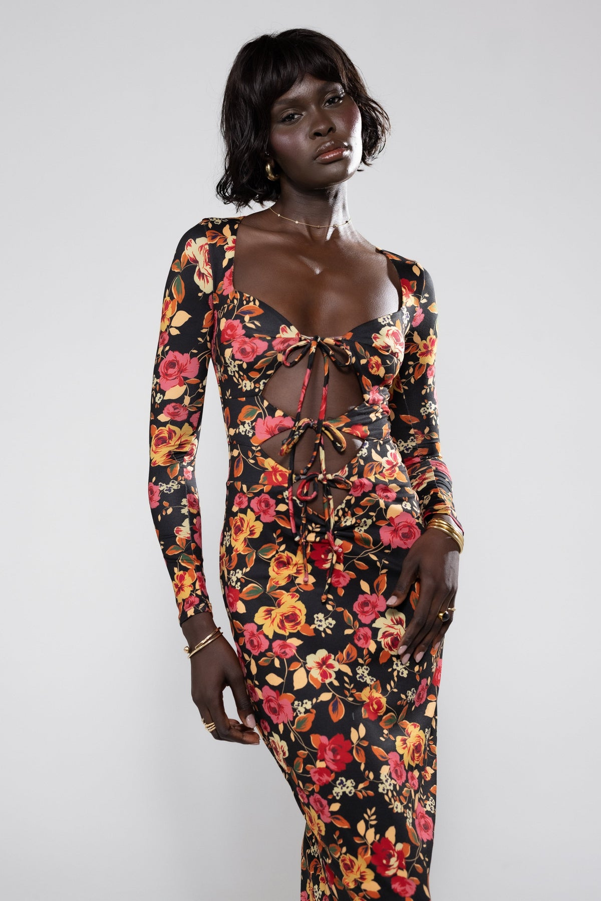 This is an image of Simone Dress in Rosie - RESA featuring a model wearing the dress