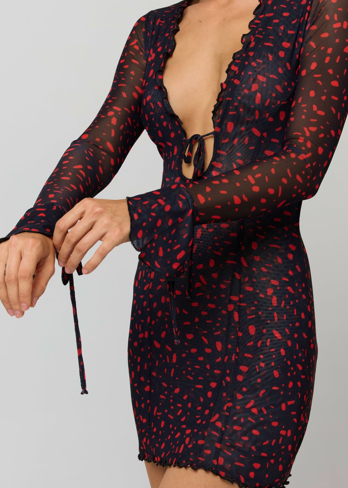 This is an image of Sloane Mini in Rouge - RESA featuring a model wearing the dress