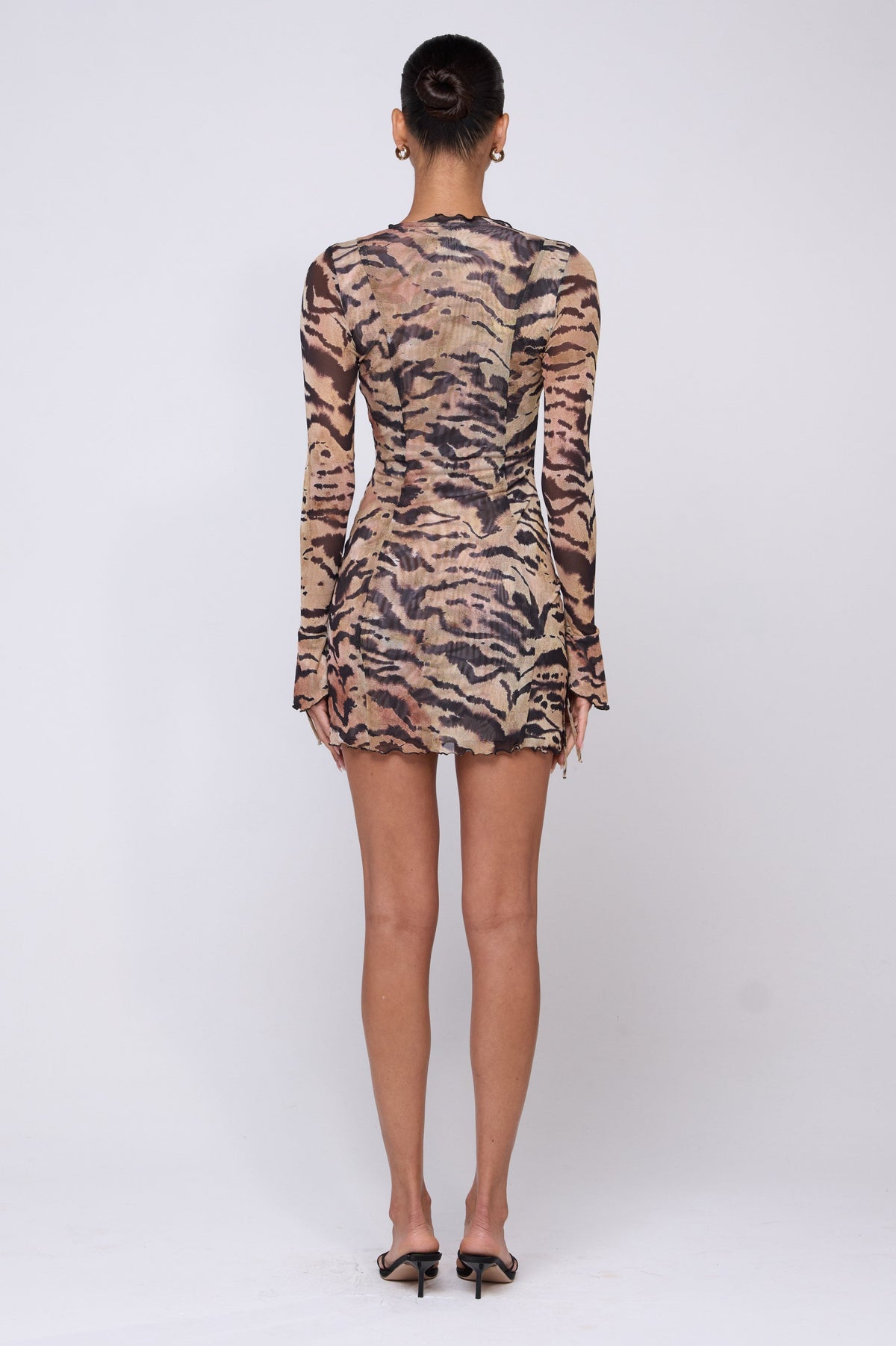 This is an image of Sloane Mini in Zara - RESA featuring a model wearing the dress