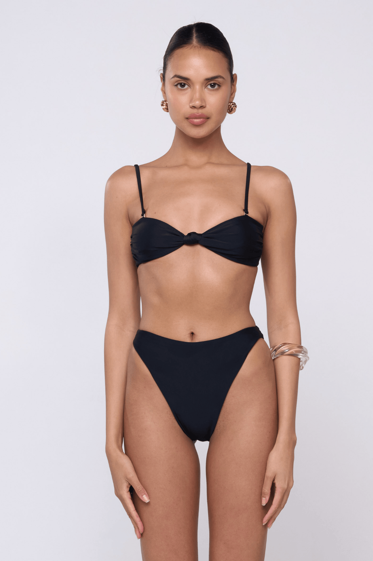 This is an image of Spencer Bikini Top in Black - RESA featuring a model wearing the dress