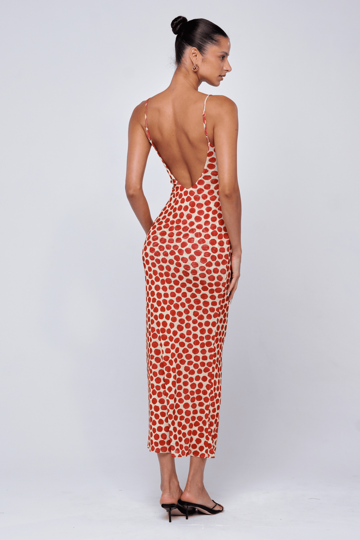 This is an image of Suki Dress in Campari - RESA featuring a model wearing the dress