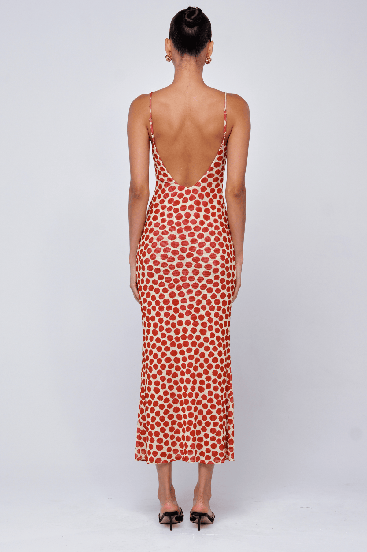 This is an image of Suki Dress in Campari - RESA featuring a model wearing the dress