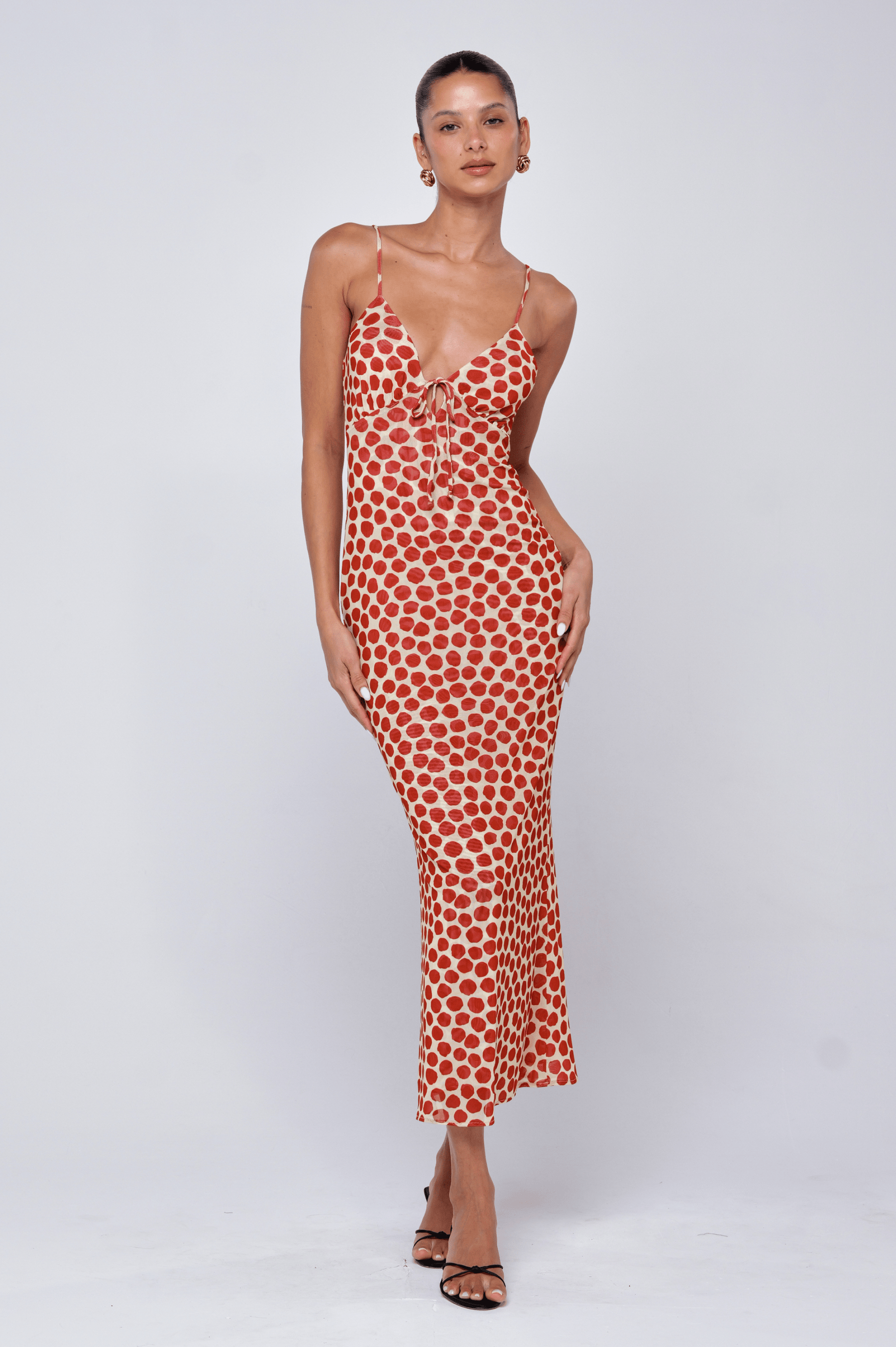 This is an image of Suki Dress in Campari - RESA featuring a model wearing the dress
