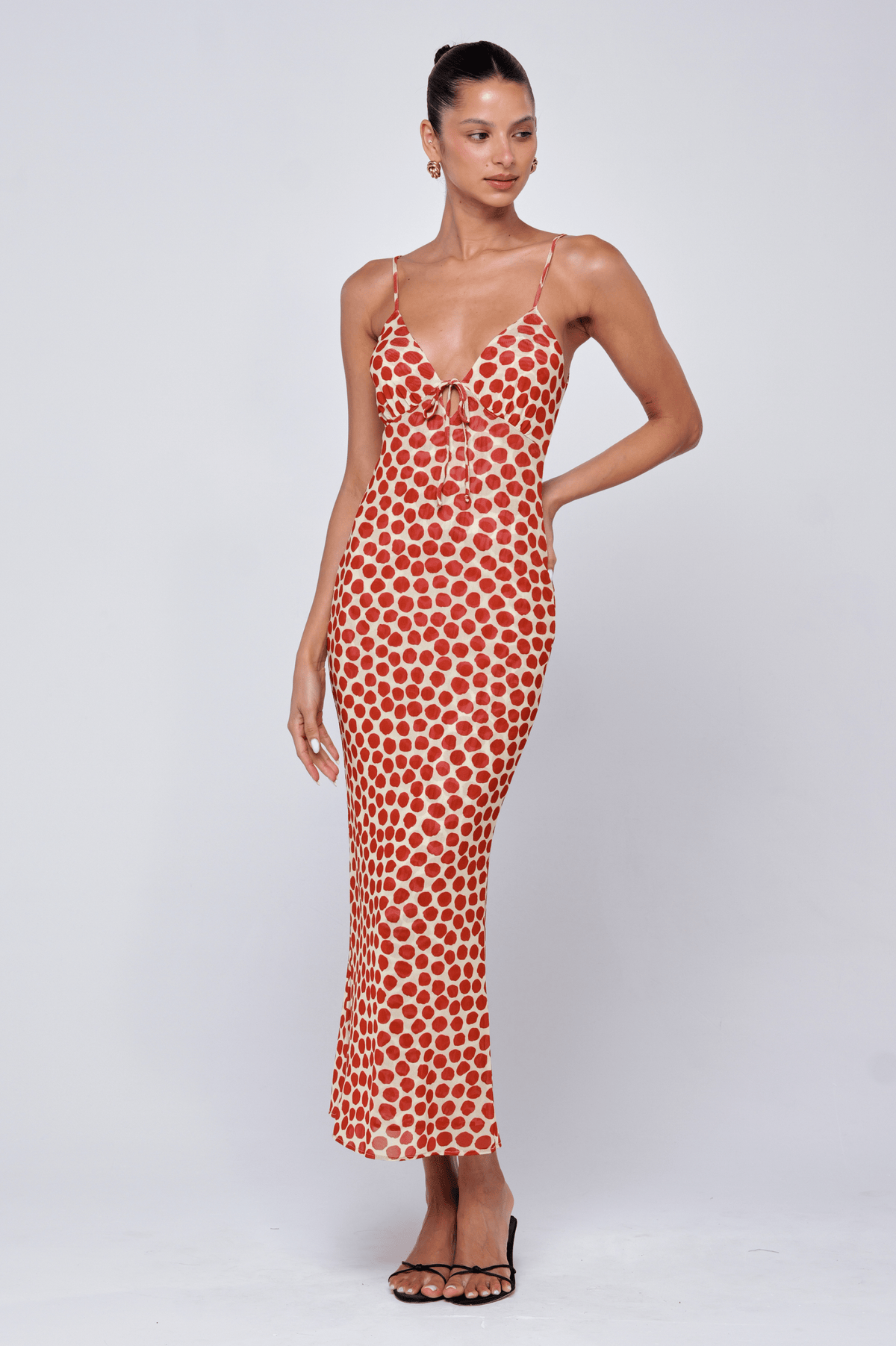 This is an image of Suki Dress in Campari - RESA featuring a model wearing the dress