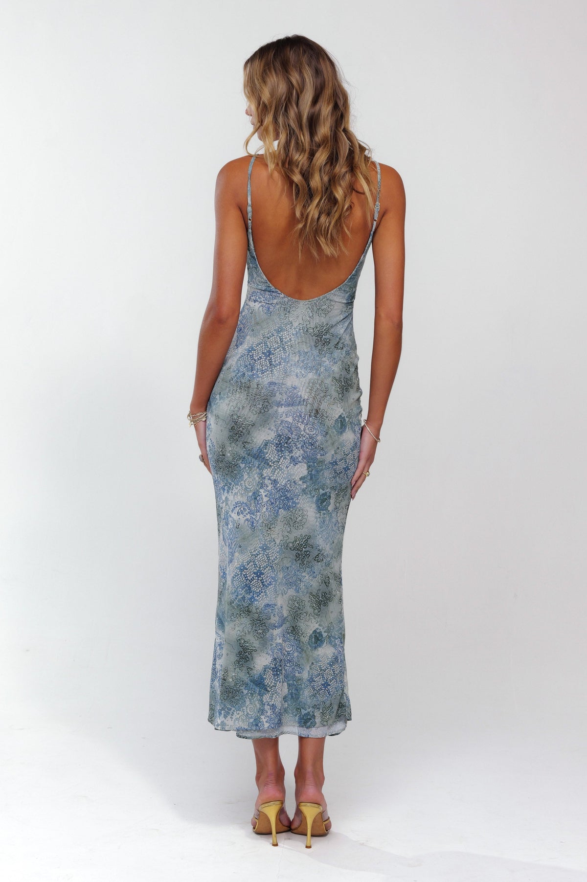 This is an image of Suki Dress in Siren - RESA featuring a model wearing the dress