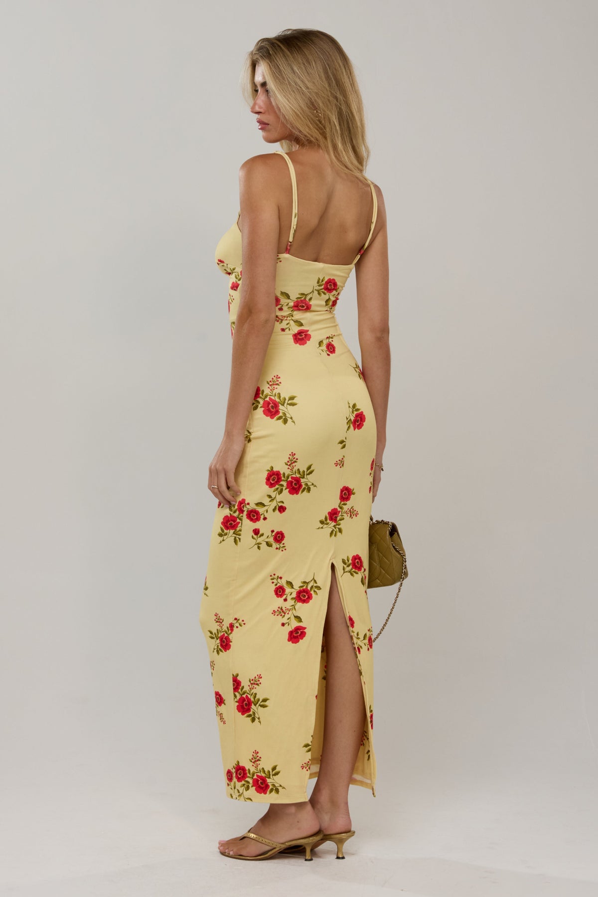 This is an image of Summer knit in Saffron - RESA featuring a model wearing the dress