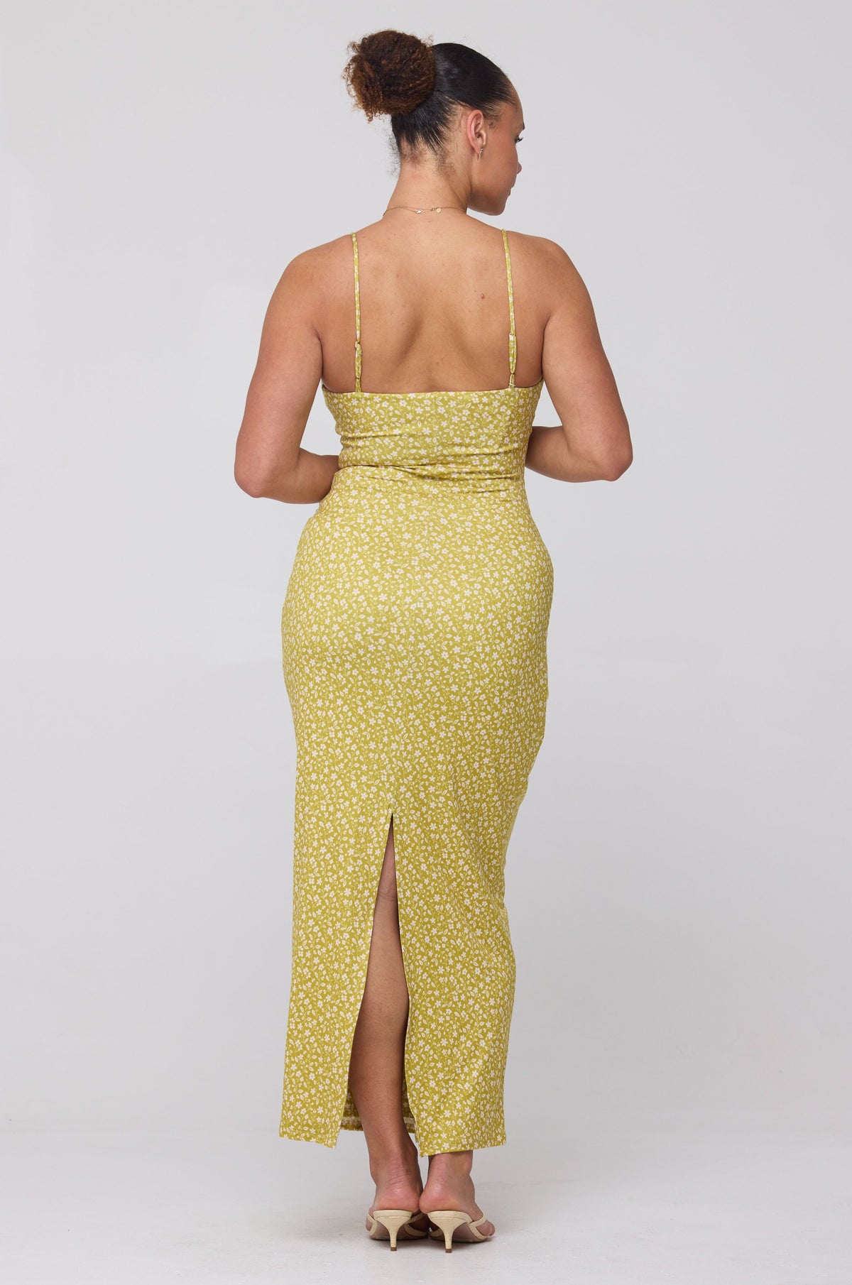 This is an image of Summer Midi in Newport - RESA featuring a model wearing the dress