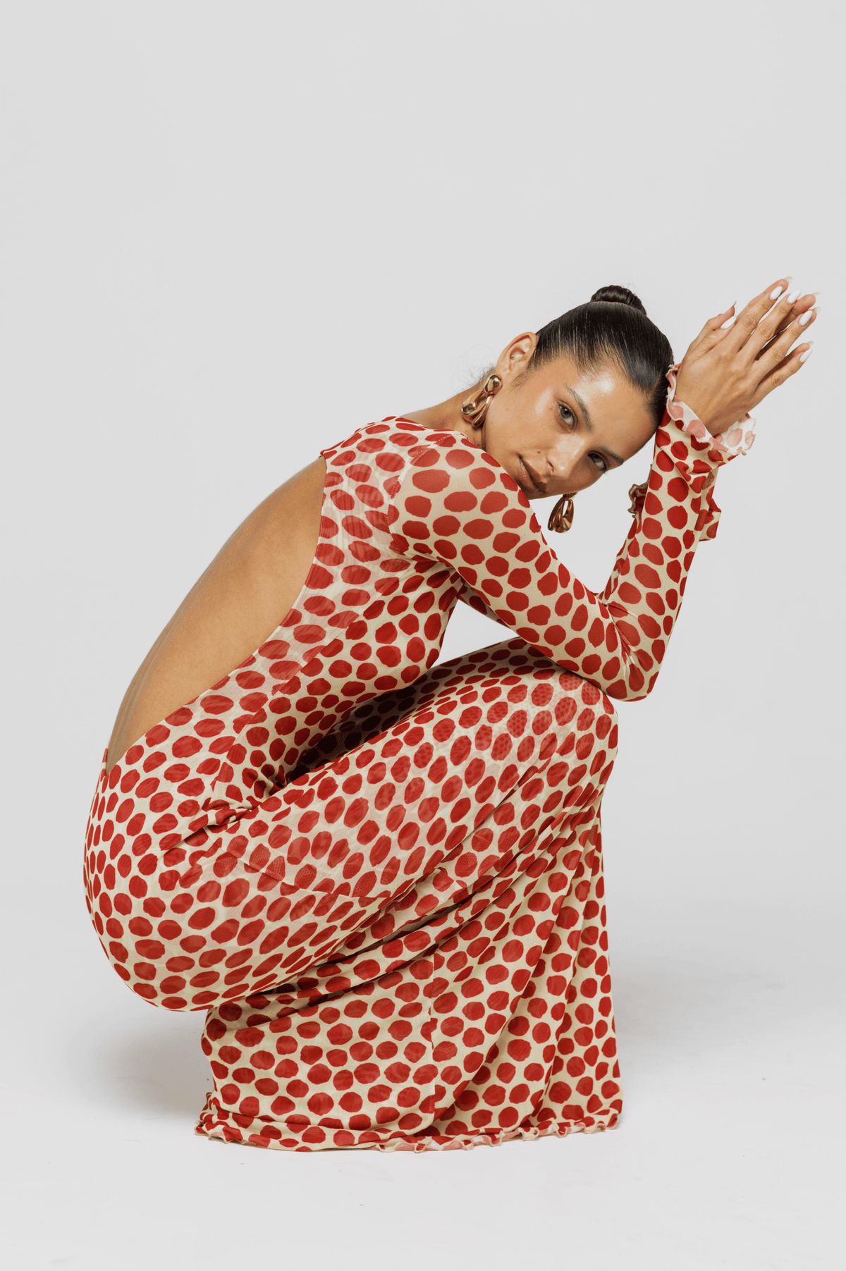 This is an image of Sylvia Dress in Campari - RESA featuring a model wearing the dress