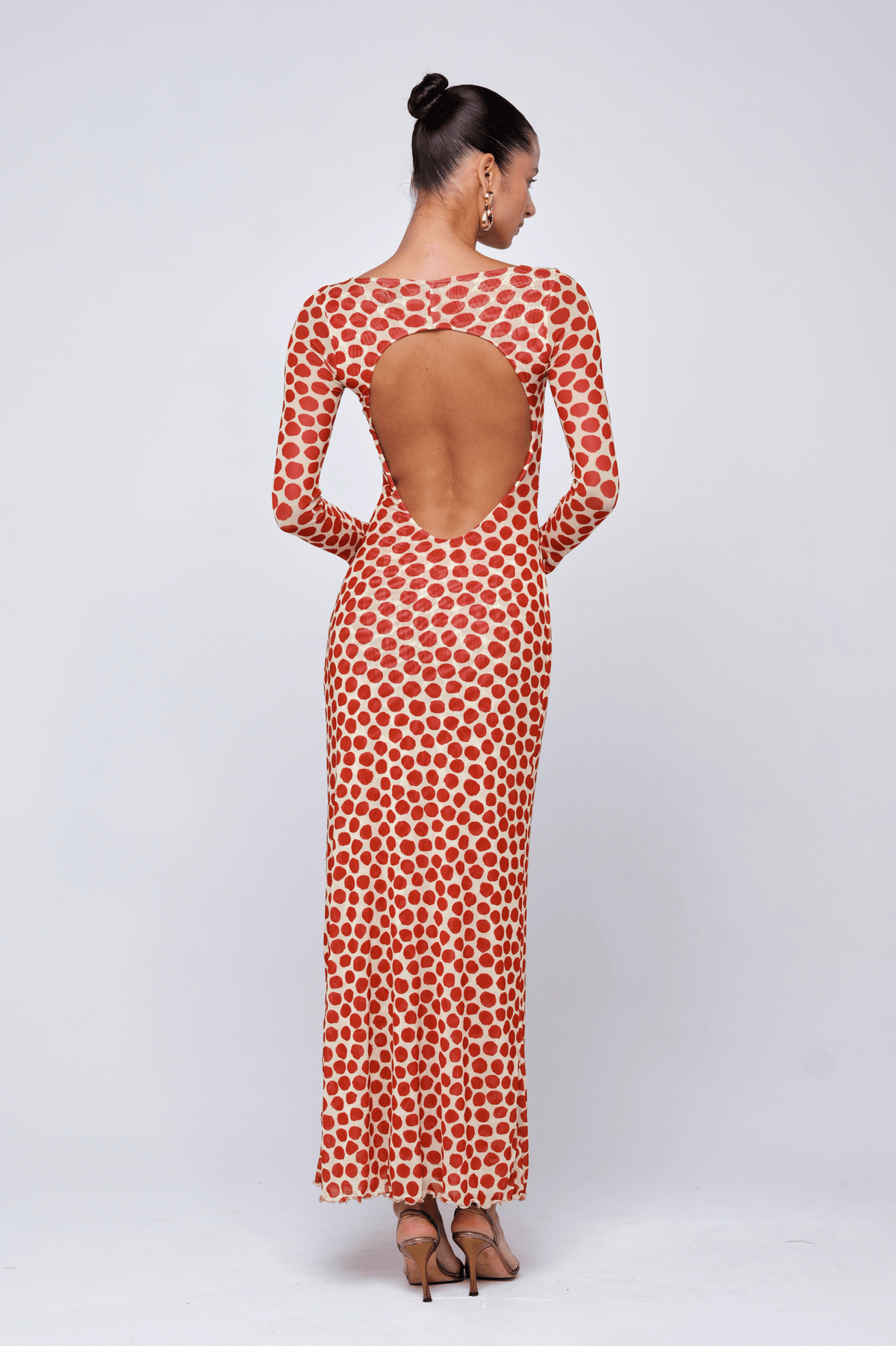 This is an image of Sylvia Dress in Campari - RESA featuring a model wearing the dress
