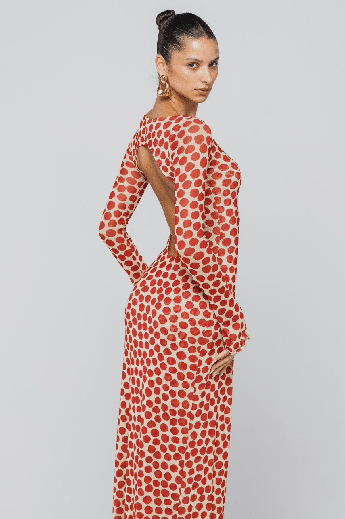 This is an image of Sylvia Dress in Campari - RESA featuring a model wearing the dress