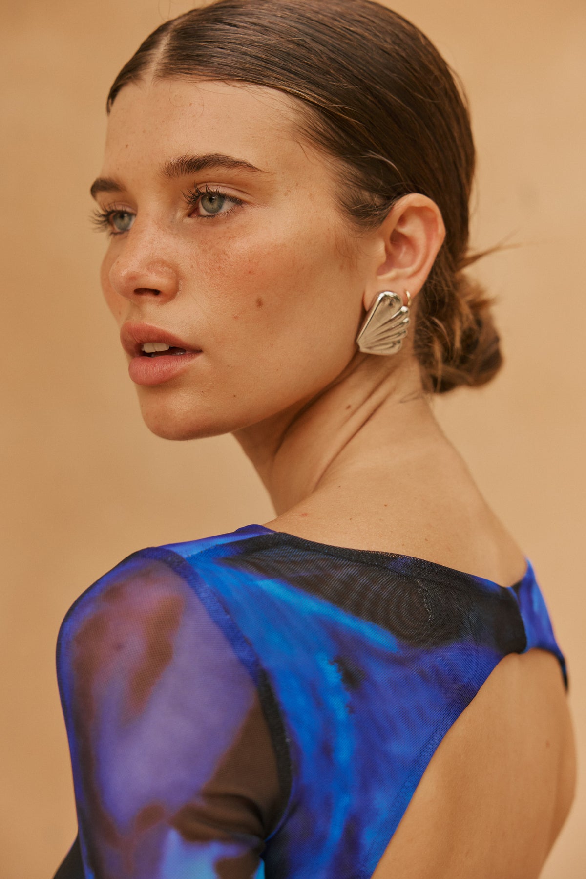 This is an image of Sylvia Dress in Lagoon - RESA featuring a model wearing the dress
